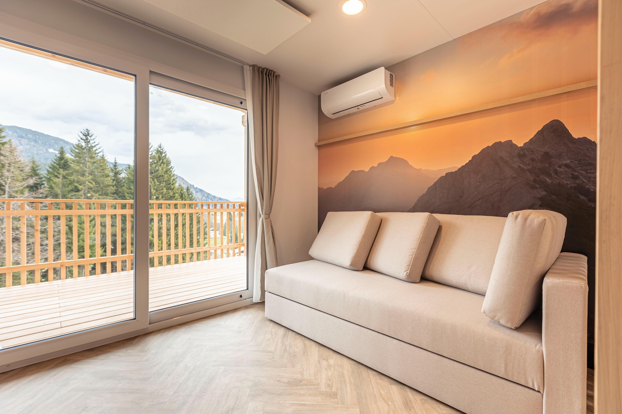 This modern, detached so-called “tree house†is located in the car-free Resort Chalets & Glamping Nassfeld, which opened in May 2022. It is located at the forest edge near the small Vorhegg skiing area. The small centre of Kötschach-Mauthen is 650 m away.
The tree house, which can accommodate up to two adults and one child of up to three years old, is furnished in a modern and complete way. The entrance can be reached via a staircase. This way, you can enjoy a beautiful view of the surrounding mountains. The living room features a TV and a single sofa bed. The open-plan kitchen is equipped with an oven and dishwasher. There is a (not fully closed) bedroom with a double bed. The bathroom features a shower and a toilet. For extra comfort, the tree house also features air conditioning.
Outside, there is a veranda with garden furniture. You can park your car in the central car park at the edge of the resort.
At Resort Chalets & Glamping Nassfeld, various chalets, tree houses and safari tents can be booked for four to six people.