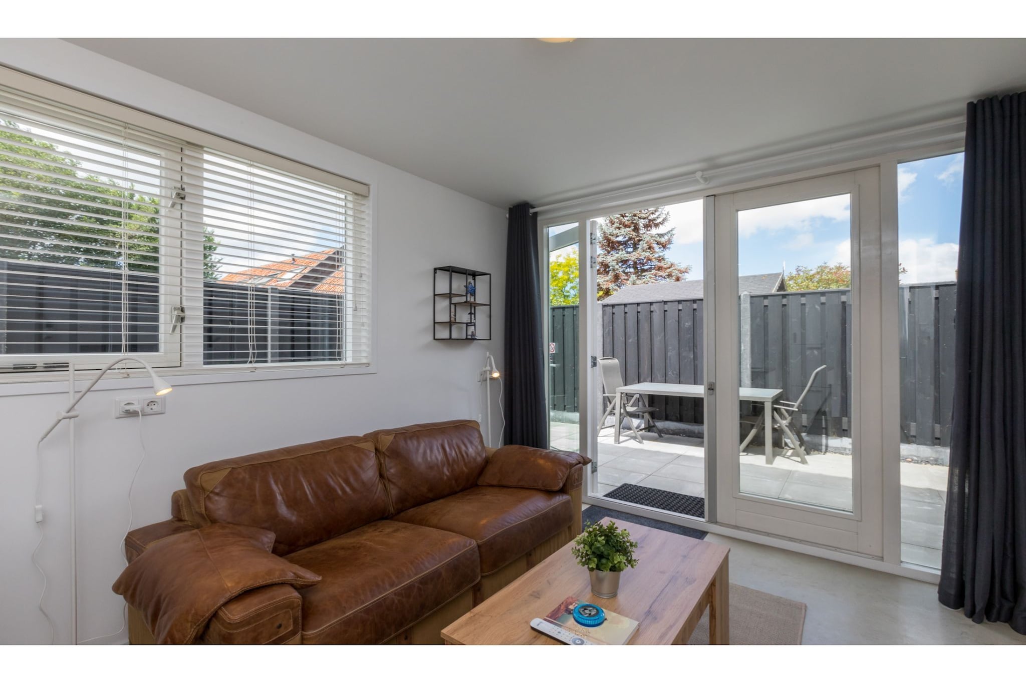 Ground floor: (open kitchen(electric kettle, coffee machine(cups), combination microwave, dishwasher, fridge), Living/diningroom(TV(flatscreen), dining table, seating area), bathroom(shower, toilet), washing machine)\n\nOn the 1st floor: (bedroom(double bed(180 x 200 cm)), sauna(infrared sauna))\n\nterrace, garden furniture, parking