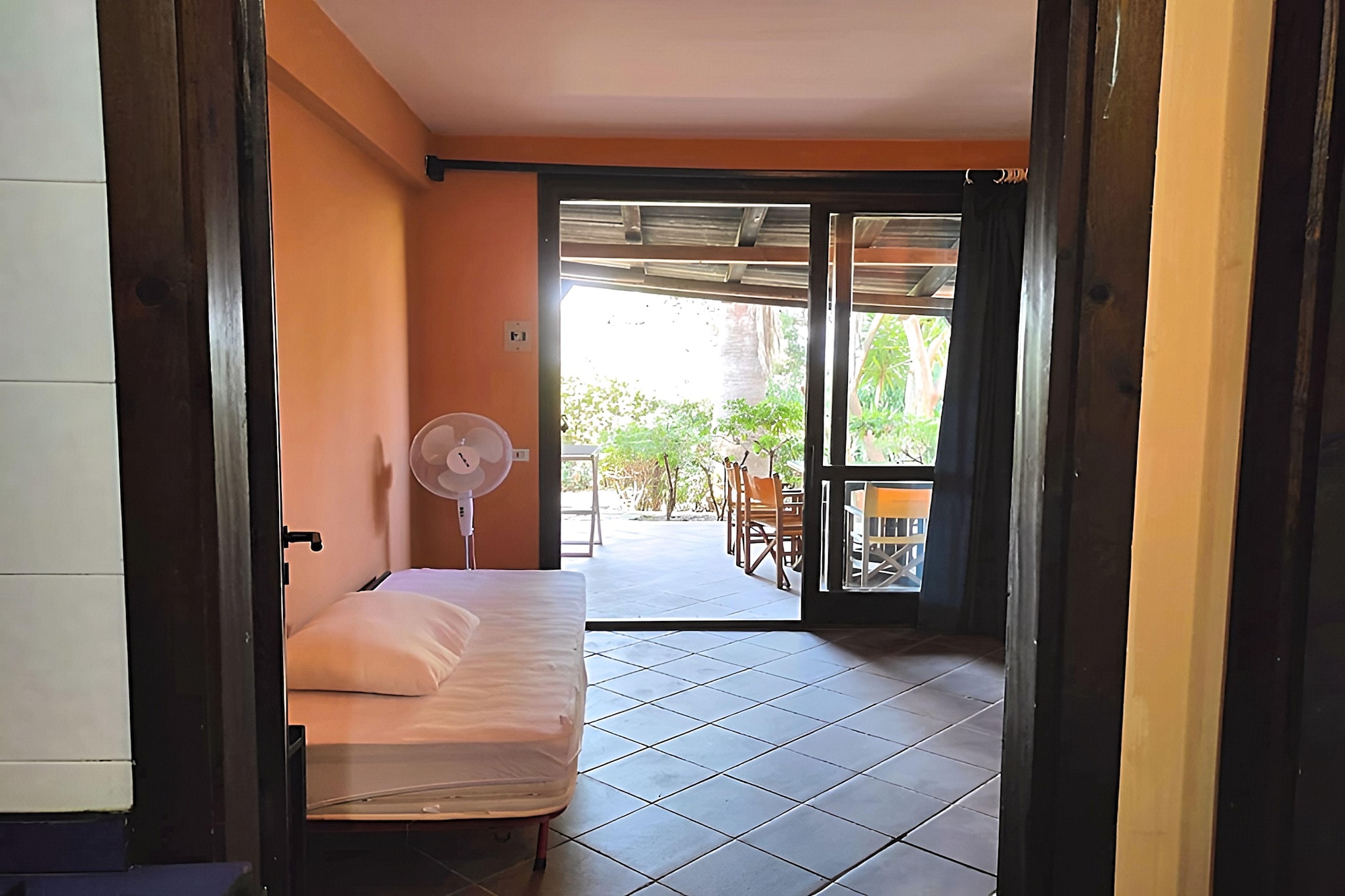 Ground floor: (Living room(dining table), open kitchen(cooker, microwave), bedroom(double bed or 2 single beds), bedroom(double bed), bathroom(shower, washbasin, toilet))\n\nair conditioning, garden, garden furniture, BBQ, parking, swimming pool(shared with other guests)