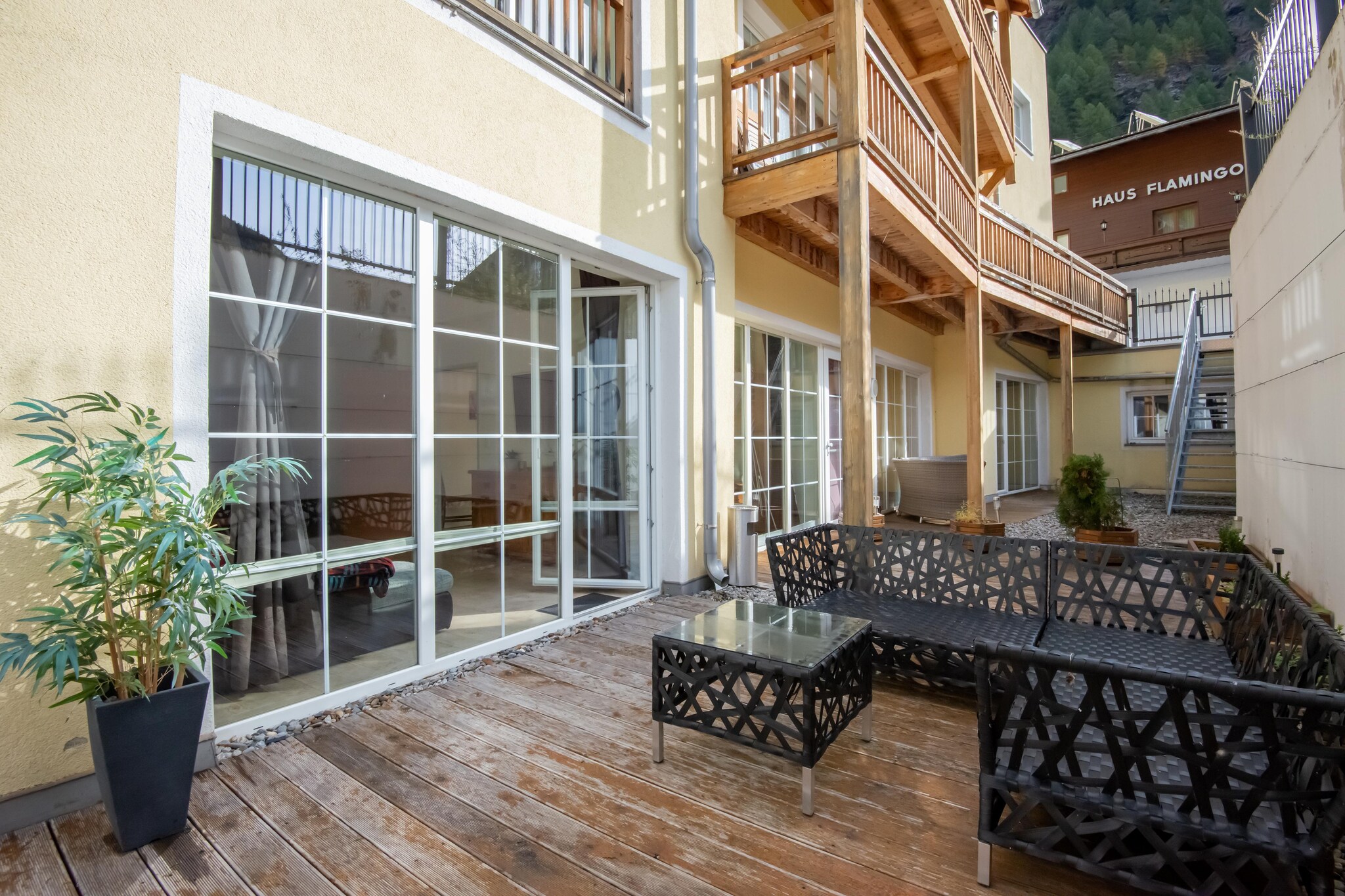 Ground floor: (Living room(double sofa bed, TV, dining table), open kitchen(toaster, cooker, oven, microwave, dishwasher, fridge), bedroom(double bed), bedroom(double bed), bathroom(bath tub, shower, washbasin), toilet(toilet))\n\nski storage, tumble dryer, washing machine, terrace, party games