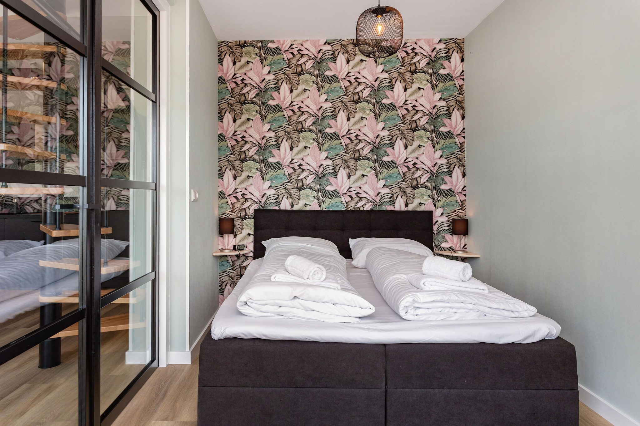 On the 1st floor: (open kitchen(dining table, electric kettle, toaster, coffee machine(cups, filter), combination microwave, dishwasher, fridge, freezer), Living/diningroom(TV(flatscreen, smart TV), seating area), bedroom(double bed(160 x 200 cm)), bedroom(2x single bed(80 x 210 cm)), bathroom(shower, washbasin, toilet))\n\nwashing machine, balcony, garden furniture, parking