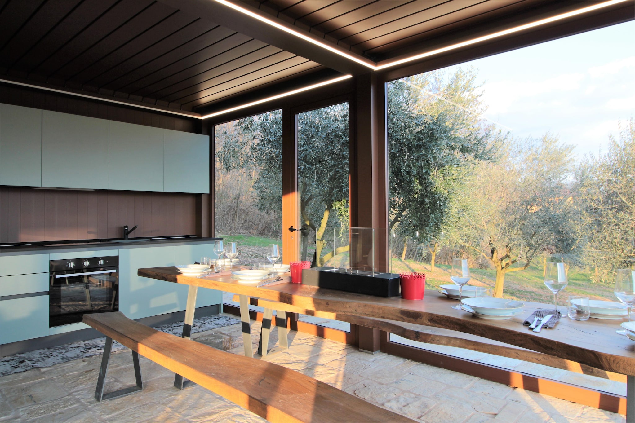 Hillside Haven with Wellness and Charm
Nestled among the olive trees of Montello's green hills, this splendid chalet is a tranquil escape designed for relaxation and togetherness. The expansive garden is a sanctuary where guests can unwind in hammocks, soak in the outdoor whirlpool, or enjoy meals under the stars. Kids can roam freely, enjoying the play equipment while the barbecue heats up. Indoors, each room boasts large windows offering romantic sunset views and natureâ€™s embrace. For cooler seasons, the Turkish bath invites guests to rejuvenate in warm serenity, creating a perfect year-round retreat.

Explore the Best of Veneto and Beyond
The location is ideal for adventure seekers and cultural explorers alike. Within easy reach are the historic towns of Treviso, Venice, Padua, and Vicenza, each offering rich art, architecture, and shopping. Nature lovers can venture 50 km north to the Dolomites for trekking, skiing, or paragliding, or head to the Adriatic beaches like Jesolo, just 60 km away. Closer to home, explore Montebellunaâ€™s vibrant town centre or tee off at Golf Asolo. Donâ€™t miss nearby medieval gems like Asolo and Bassano del Grappa, perfect for a scenic afternoon drive.

A Culinary Journey
Food and wine lovers are in for a treat. Begin your gastronomic adventure right from the chalet with a short drive along the Strada del Proseccoâ€”Italyâ€™s iconic Prosecco Routeâ€”where countless wineries in Valdobbiadene and Conegliano offer tastings. For dining out, savour authentic Veneto cuisine at local trattorias or explore the flavours of Trevisoâ€™s rustic restaurants.