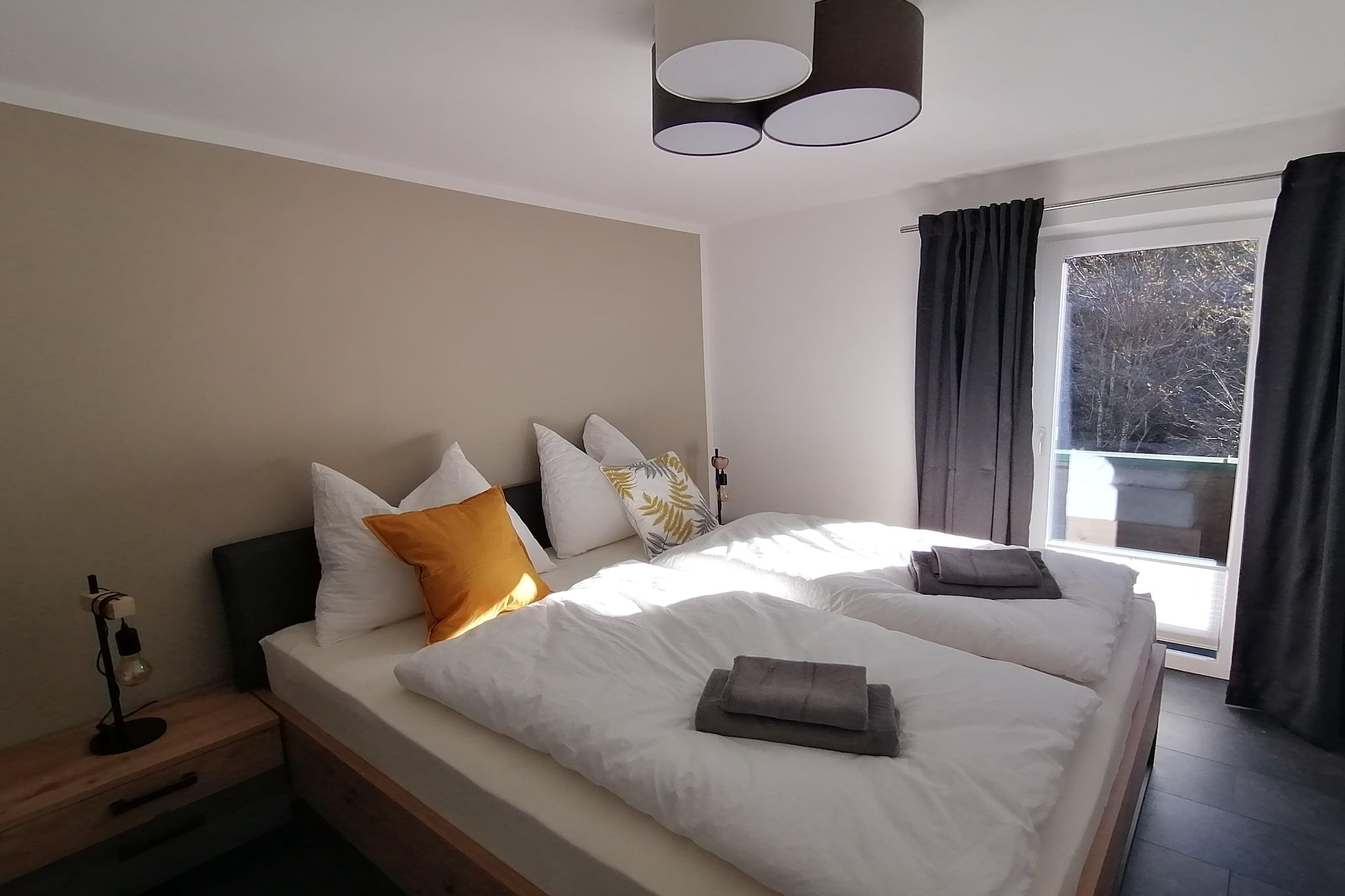 On the 1st floor: (hallway, Living room(double sofa bed, TV, dining table, balcony), Kitchen(seating area, toaster, cooker, coffee machine, oven, dishwasher, fridge-freezer), bedroom(double king size bed, balcony), bedroom(double king size bed, balcony), bathroom(shower, washbasin), toilet)\n\nski storage, ski boot heaters, garden, bicycle storage, garden furniture, play equipment