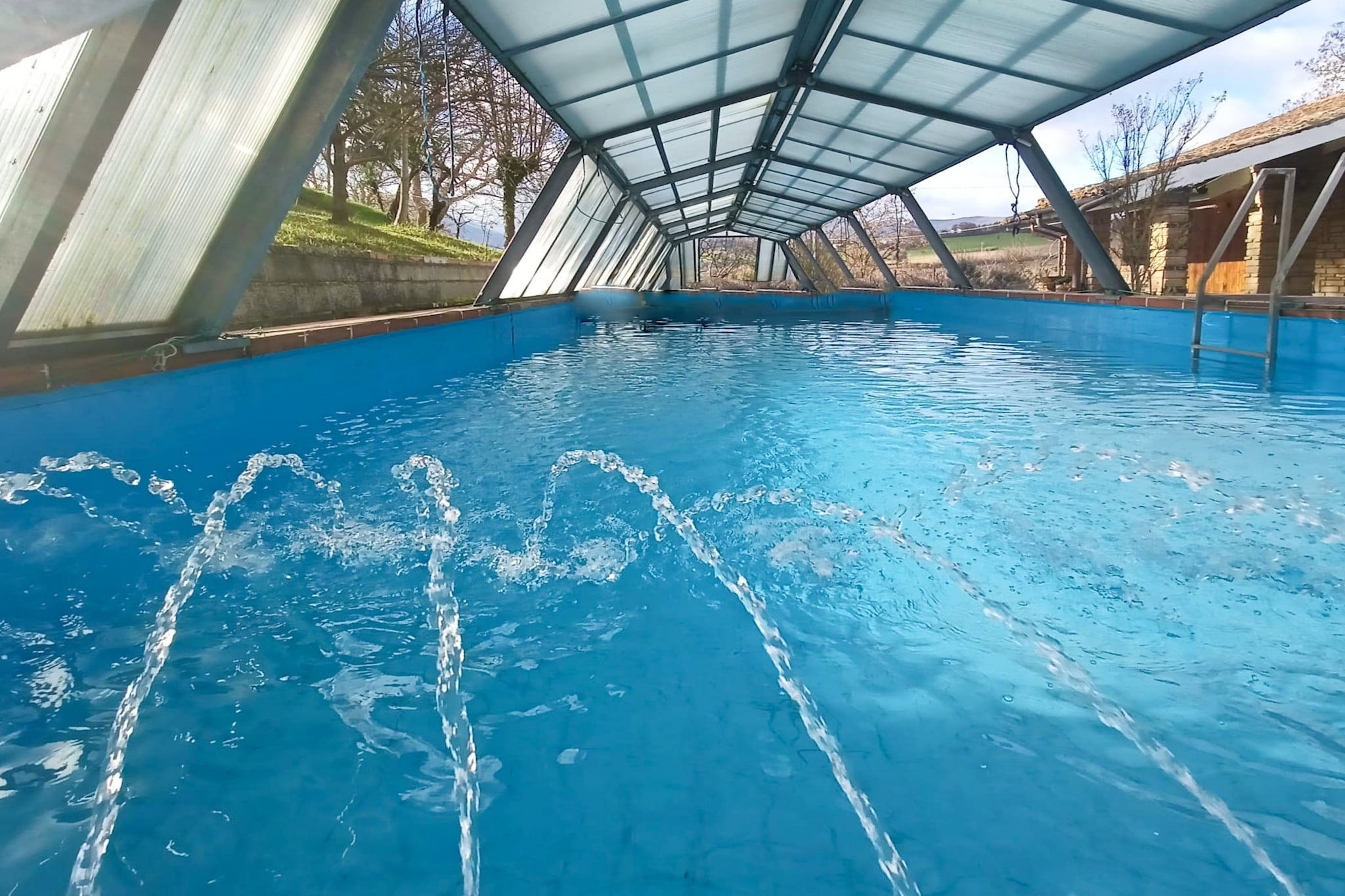 An optional utilities and service fee of EUR 300,00 will be charged before your arrival. Details are given below.<br> This stone farmhouse has a very authentic style, with furniture from the 70s and modern facilities. The private swimming pool is open from May to October and you can enjoy an unforgettable holiday with family or friends. The town of Matelica, famous for its Verdicchio wine, is a 5-minute drive away. The area is full of cellars where you can taste wine and in the center, in the foyer of the theater, is the city cellar. You can go shopping for a day at the nearby Armani outlet and the region is home to many nice, historic villages and beautiful walking and cycling routes. You can start the day with breakfast under the veranda, before cooling off in the long, narrow swimming pool, which is ideal for swimming lengths. The property also includes a wood-burning oven and barbecue. In the well-furnished garden, you can relax. On the back, the wood-burning oven and the BBQ await you for pizzas and tasty grills. The parking facility is also available here. <br><b> Optional Utilities & Service Package </b><br><b> An optional utilities and service package of EUR 300,00 </b> can be selected prior to your arrival. You will receive a separate communication with the payment link should you wish to include it.<br>This package ensures a seamless stay and conveniently covers services such as final cleaning, utility consumption, service support, and protection against minor damages or incidental costs during your stay.<br>Guests who prefer may manage these services independently, provided the property is returned in good order at check-out.