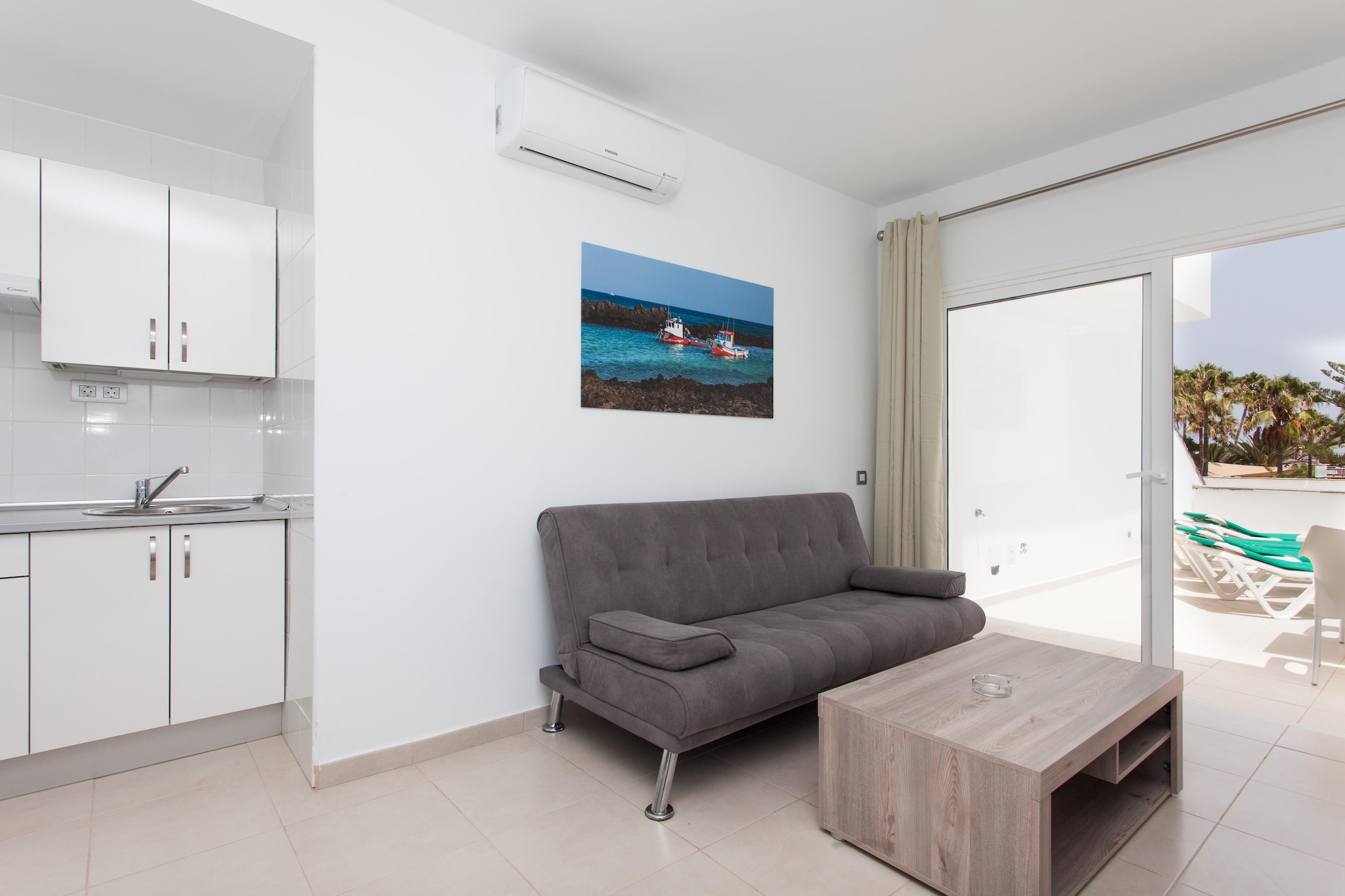 There are few accommodations that can enjoy such a special situation. TAO Caleta Playa is located on the beachfront with views of the sea and just 200 meters from the center of Corralejo. The atmosphere of this small group of apartments is pleasant and calm, around a peaceful swimming pool sheltered from the wind. Our proposal invites you to enjoy the proximity of the sea, on a beach with direct access, where you can relax and enjoy the sun with the sound of the sea in the background, or admire the colors of the sunset among the silhouettes of the palm trees of Corralejo, but close to all the services you want. An inspiring place whether you come alone, as a couple, as a family or as a group of friends. We suggest you try the routine of dipping your feet in the sand as soon as you wake up. The accommodation has rooms adapted for people with reduced mobility (on request).

About Belvilla

At Belvilla, you experience holidays exactly the way you want. Choose from an extensive range of holiday homes, apartments and caravan parks from Europe to Florida. From a cabin by the Norwegian fjord to an exclusive villa on the CÃ´te d'Azur, and from an apartment in Rome to a country estate in Tuscany. At Belvilla you will find the perfect holiday home for an unforgettable time with your family, partner or friends. You will also find holiday homes for larger groups, spread across various regions in Europe.

Belvilla offers a wide variety of holiday homes: small and cosy with a sauna or spacious with an outdoor pool, roof terrace and numerous bedrooms. At Belvilla, for example, you can choose from holiday homes in prime locations, with luxury amenities and homes particularly suitable for families. Of course, many holiday homes also have a space reserved for your dog. You can choose from practical holiday homes in popular holiday destinations, city houses in cosmopolitan cities such as Venice or Rome, dreamy holiday homes in top locations and spacious holiday homes with unique furnishings. Besides holiday homes by the sea, Belvilla also offers holiday homes with swimming pool and/or wellness facilities.