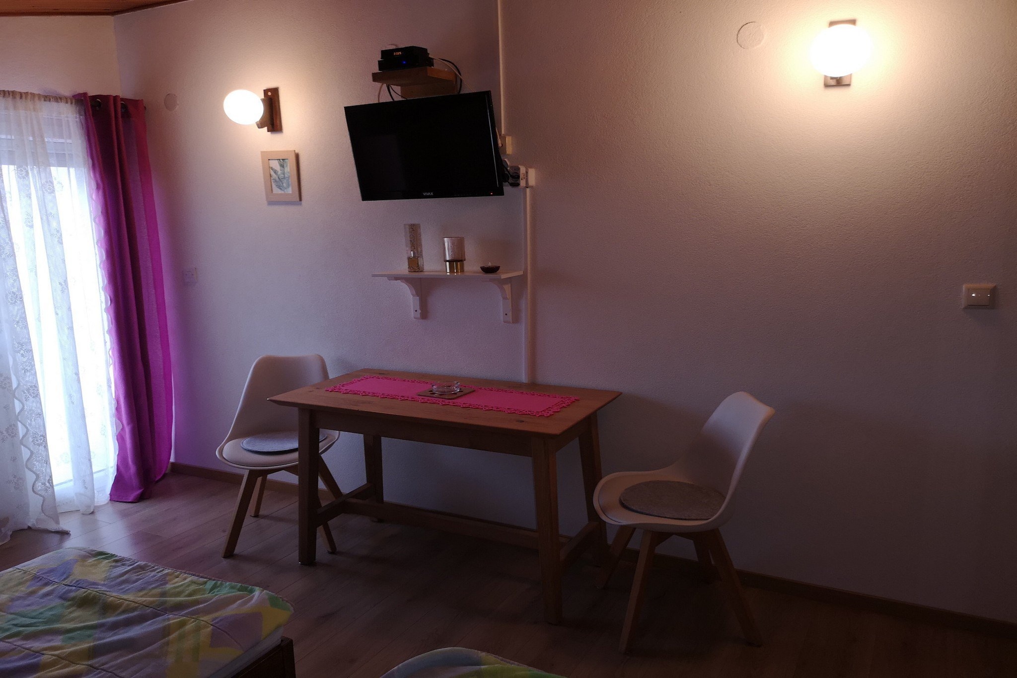 Apartments Snježana Carev are located in a quiet part of the island of Murter- an island in North Dalmatia connected to the mainland by a bridge in a place Tisno.

Shared garden as well as an outdoor dining area with BBQ are at your disposal, which makes this place ideal for a nice and relaxing family or friends vacation. Free Wi-fi is available throughout the property. All the units feature air-conditioning as well as a SAT LCD TV.

Laundry room with washing machine and dryer is at your disposal. 

Private parking is provided, reservation is not required. 

Pets are available with notice and additional coast of 14 euros per night.

This studio apartment with terrace can perfectly fit up to two people. It features air-conditioning, as well as SAT LCD TV. Kitchen is well equipped with refrigerator, water kettle, microwave and kitchen utensils. Coffiee maker is available on request. This studio apartment comes with large double bed as well as single sofa bed. Private bathroom comes with shower and toilet. Hair dryer as well as linens and towels are at your disposal.
This apartment is located on the first floor.

If you want to spend your vacation in a peaceful and quiet environment, far from the city crowds, and also to have nearby all you need during your holidays, Apartments Snježana Carev are the best choice for youTraditional dishes are a You can find restaurants and bars within 400 m from the property.  Beach is only 600 m away from the property. Grocery store is 700 m away.

Airport in Zadar is 43 km away from the property, bus station is only 400 m away.