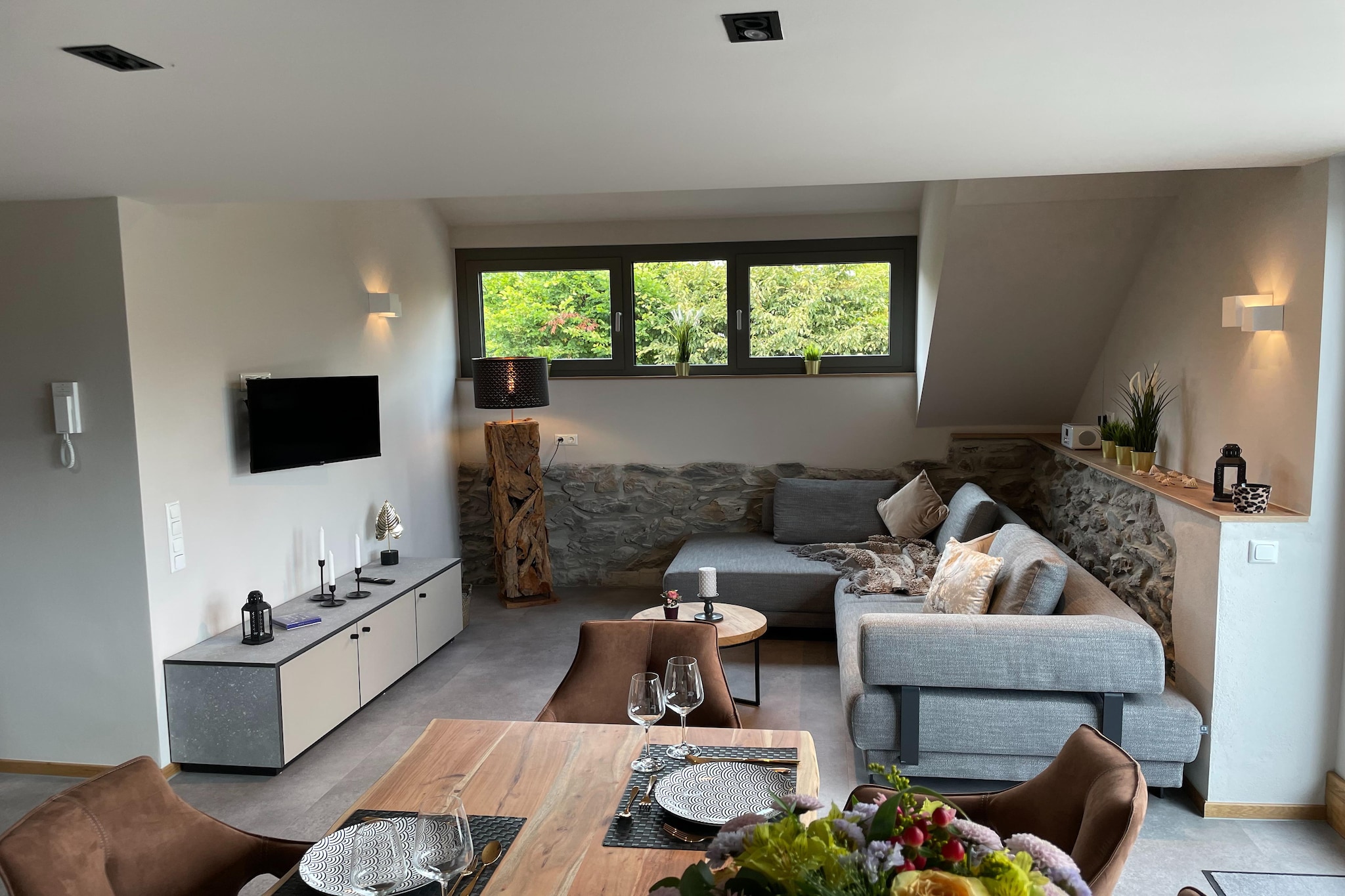 Monschau in the Eifel and this stylish and modern holiday home invite you to spend a comfortable and relaxing holiday. Couples, friends and families can relax in the shared sauna or enjoy the beautiful view of the meadows and the town from the spacious terrace.

The apartment is located in the district of Mützenich in Monschau, which is known for its medieval center with half-timbered houses, its narrow cobbled streets and the castle. The Eifel National Park with many hiking trails is located near the city. You can also start directly from the house for beautiful hikes and walks.

The apartment on the upper and attic floor has a large cooking, dining and living area with the latest equipment, TV and sofa bed, which is adjoined by the beautiful terrace equipped with garden furniture. Bicycles can be parked and e-bikes charged in the existing carport.

About Belvilla

When you stay in a Belvilla home, you can rest assured of a unique holiday home in ideal surroundings at an attractive price. The portfolio of accommodations consists of more than 40,000 holiday homes in 20 European countries. Interested in a weekend getaway, a summer or winter sports holiday or simply a short break? Do you prefer the coast, countryside or mountains? Whatever your preference, there is a Belvilla home to meet your needs, from a cosy gîte for two to a castle big enough for the entire family, from an apartment in the heart of Rome to a cabin in the middle of nowhere, from a simple tree house to a luxury dream villa and from close to home to the other side of Europe.

A Belvilla home gives you the freedom to enjoy breakfast in your pyjamas or continue a good conversation into the morning hours without having to worry about the bar's closing time. Prepare gourmet meals with fresh local ingredients in your own kitchen and take advantage of having your own swimming pool to do as many cannonballs as you want! In other words, you can enjoy complete privacy in your home away from home.