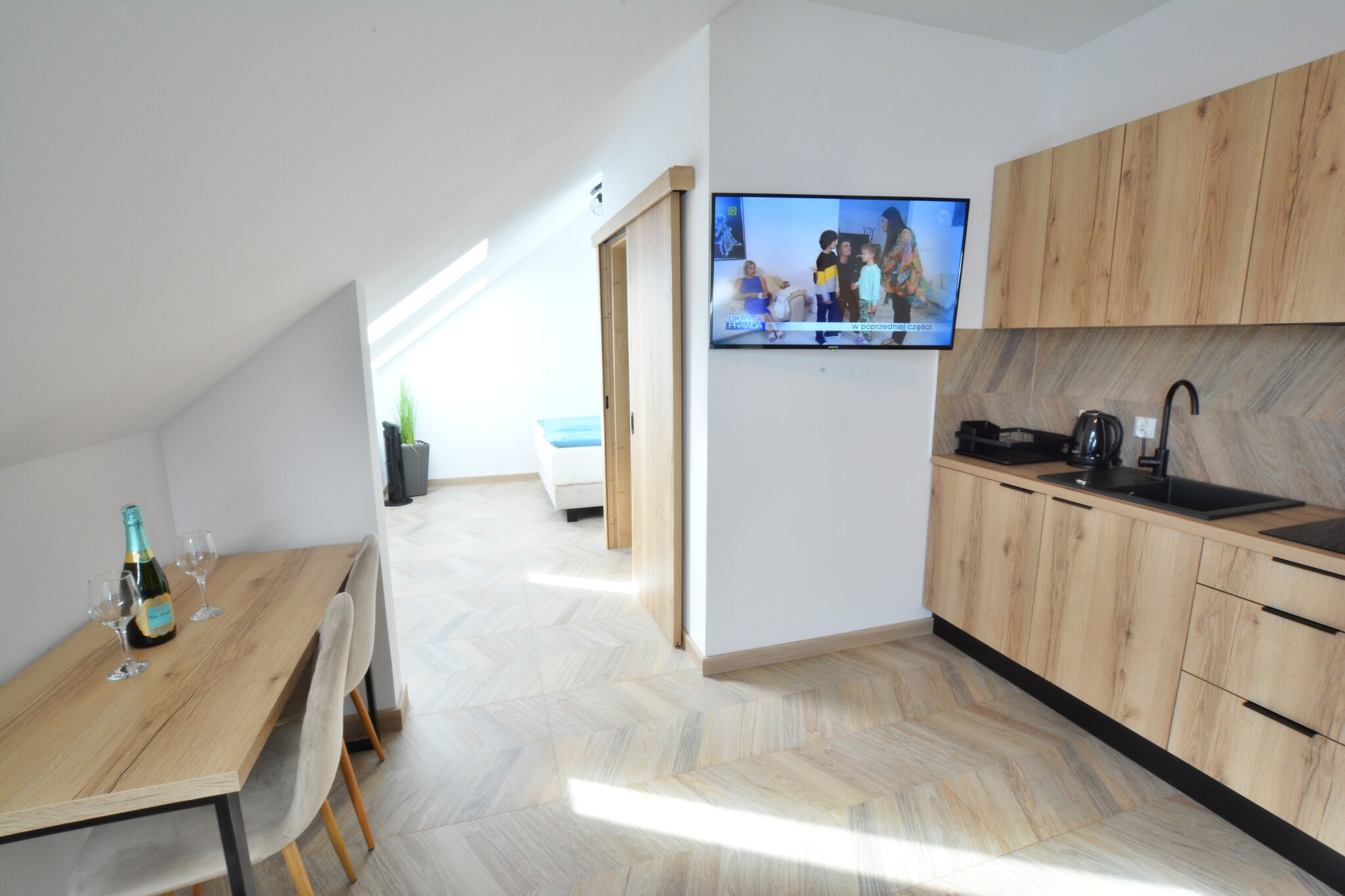 An intimate apartment building in the heart of the resort, practically right on the beach, only 50 m from the sea. There is a small bar on the ground floor. There are many other dining options, souvenir shops and cafes nearby.

The comfortable holiday apartment is located on the 3rd floor. An undoubted advantage is the partial sea view, which can be admired from the bedroom window. The apartment consists of a living room with a sofa bed, a table and a TV. There is also a bedroom with a double bed, a kitchenette and a bathroom with a shower. The bedroom is not locked, but is located at a distance from the living room, which ensures privacy. Central heating. Wireless internet is available. There is free parking by the apartment.

The price of your stay includes: bed linen, towels, water and electricity consumption, final cleaning, internet, parking.

Ustronie Morskie is located in Western Pomerania, 10 km east of KoÅ‚obrzeg. Sandy, clean beach, walking pier, seaside climate, picturesque cliff are the advantages of this resort. Ustronie Morskie is a well-known and popular holiday resort on the Polish coast - many cultural and sports events are organized here. Active people, in addition to sunbathing and sea bathing, can take advantage of hiking and cycling trips, horse riding and sightseeing flights. The water in this region is among the cleanest on the Polish Baltic coast and safety is ensured by qualified lifeguards equipped with specialist equipment. Attractions in the area: fishing port and colorful fishing boats standing on the beach. There are two walking piers in Ustronie Morskie. Fans of swimming in the pool are invited by the local Aquapark Helios (indoor swimming pool, outdoor swimming pool, hydromassage, whirlpool). In this sports complex, guests can also enjoy a bowling alley, tennis courts and sports fields. The Aquapark is located approx. 700 m from the resort.