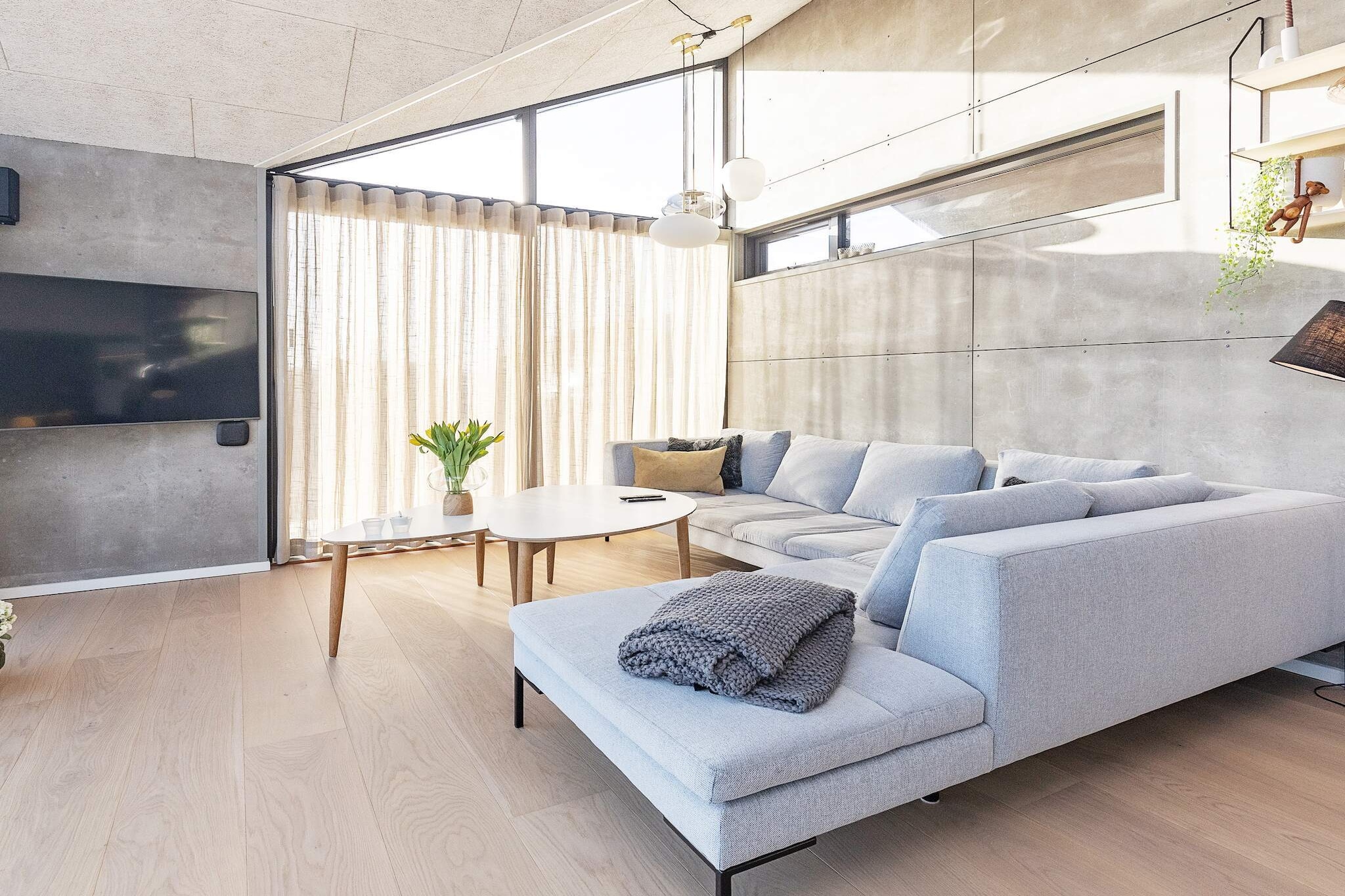 High-quality vacation home with stylish and cozy decor and a fantastic location on a hilly plot at Tornby Strand with scenic experiences right outside the window. The vacation home is tastefully decorated with attention to detail, so that the whole house works together as a whole, both inside and out. If you want something a little out of the ordinary, this modern and well-appointed vacation home is worth a closer look. The style is modern, cozy, and functional, with four large, bright bedrooms with good beds and closet space. Open entrance hall with washer and dryer. In addition, there are also two beautiful bathrooms and an outdoor shower. The heart of the cottage is a large, open living room with good acoustics, connected to the well-equipped kitchen. There is room for everyone to get together and enjoy cooking, meals, games, a good movie in the house's alcove, or whatever else takes your fancy. The room has several windows, allowing the fascinating North Jutland light to flood in, and on warm days you can open up onto the terrace. A lovely terrace surrounds the house, so you can always find a sunny spot no matter what time of day it is. There are covered areas if you prefer to sit in the shade on bright summer evenings. An air/water heat pump has been installed, making heating, consumption, and charging of electric cars as environmentally friendly as possible. Not available for rental to youth groups. There are 2 high chairs.A refundable deposit might be charged closer to your check-in date. The security deposit ensures a smooth stay and covers any additional services or consumption charges.This deposit covers utilities consumed during your stay and any additional services that may be taken.The final amount will be adjusted based on actual meter readings, actual usage of extra services, and any remaining balance will be refunded within 21 days after checkout.This deposit simply acts as a prepayment for charges that  you would anyways pay for, ensuring a seamless stay and check-out experience.