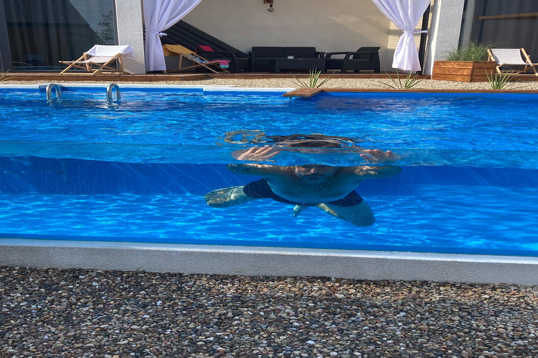 Ground floor: (open kitchen(dining table, electric kettle, boiling water tap, toaster, cooker(2 ring stoves, induction), espresso machine, oven, dishwasher, fridge-freezer), Living/bed room(double sofa bed, TV(satellite, german television channels)), bedroom(double bed), bathroom(shower, washbasin, toilet))\n\nOn the 1st floor: (bedroom(single bed, single bed), bedroom(double bed))\n\nOpen air pool, Sauna, terrace, garden(shared with other guests, fenced, landscaped garden), garden furniture, sun loungers, parking, swimming pool(shared with other guests, heatable, including separate childrenâ€™s swimming pool (depth 50cm), 10 x  5 m., opened from May upto and including Sep), sand pit, football goal, Volleyball court