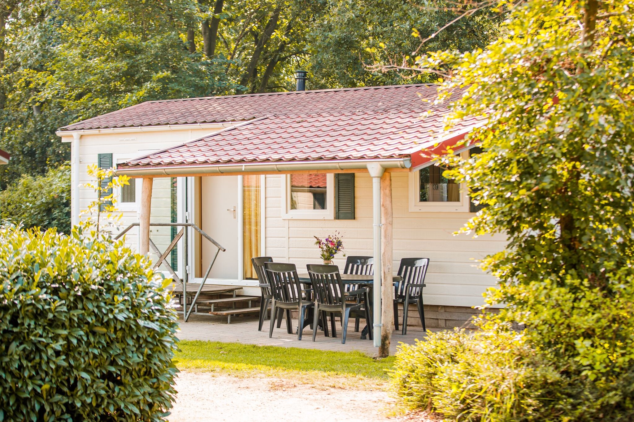 Nice chalet with covered terrace at a holiday park on the Leukermeer