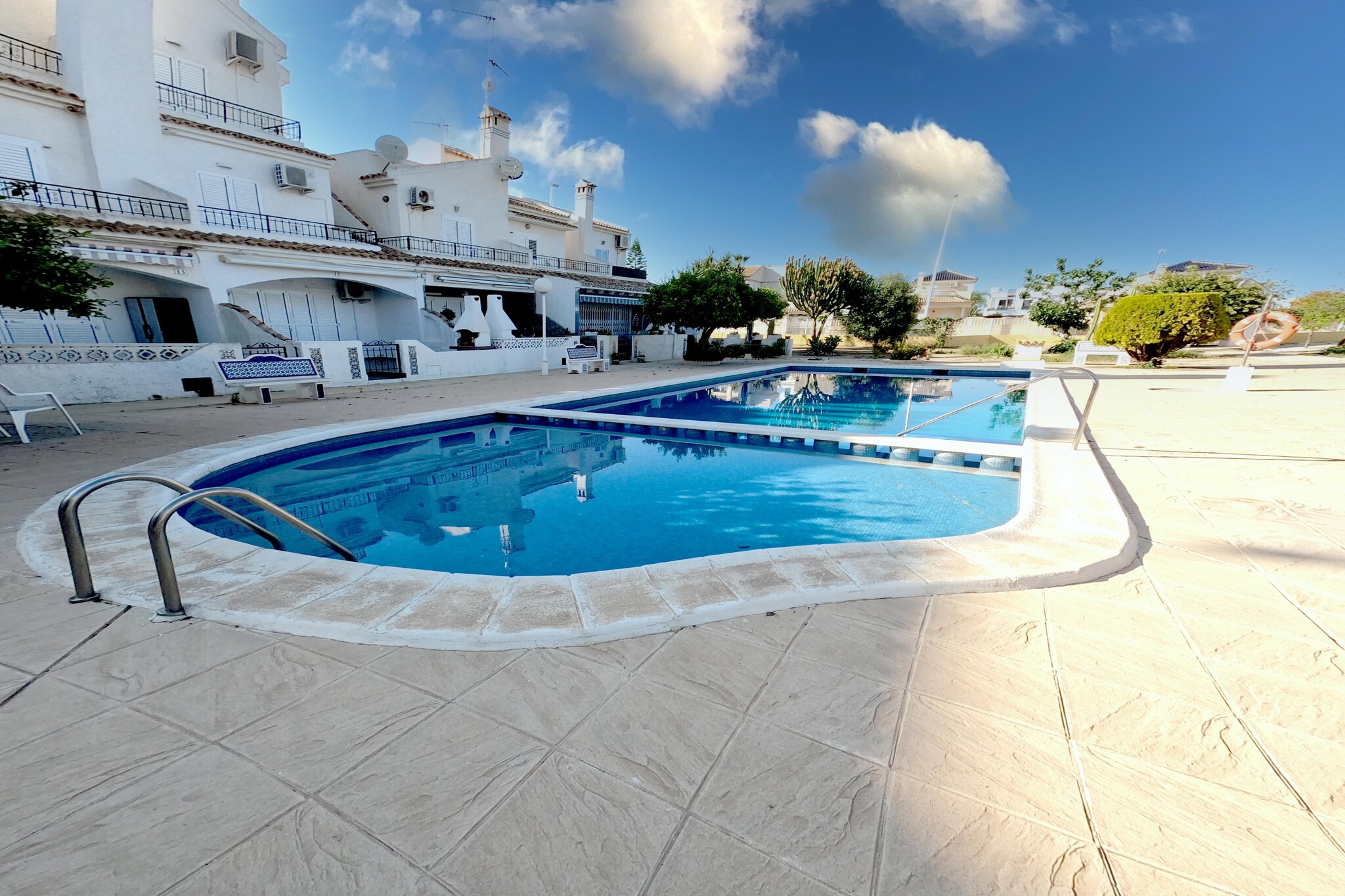 This beautifully maintained townhouse consists of 3 floors and is centrally located in a fantastic location. The house has two bathrooms, 3 bedrooms and a fully equipped kitchen. All rooms are air-conditioned and the bedrooms are also equipped with lamp fans. On the terrace you can relax in one of the sun loungers and take a dip in the communal swimming pool.

The sandy beaches of Cabo Roig and Cala Capitan are a 10-minute walk away. La Zenia beach is a 15 minutesâ€™ walk away. There are plenty of bars and restaurants (the strip) within a 5 minutesâ€™ walk from the house. Within 10 minutesâ€™ drive are the 4 championship golf courses. 

There are also a ladies and men bicycles for exploring the region. In the garden, you can enjoy barbecue meals along with drinks. This is a child-friendly property where you can get childâ€™s bed and a high chair. Beach towels are provided and that saves a lot of space in your suitcase.

The airport pickup facility is also available for a fee. 
