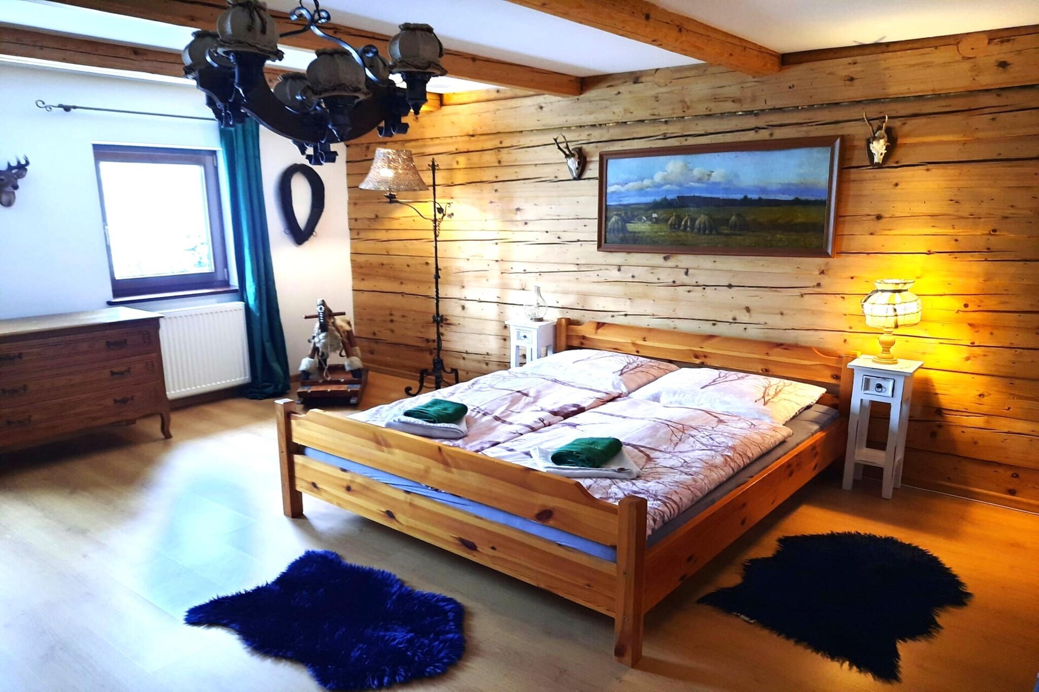 Ground floor: (Living room(TV, fireplace, seating area), dining room(dining table), Kitchen(hob, electric kettle, toaster, hood, espresso machine, oven, microwave, dishwasher, fridge-freezer), bedroom(double bed), bathroom(bathtub or shower, washbasin, toilet), washing machine)\n\nOn the 1st floor: (bedroom(double bed), bedroom(double bed, double sofa bed), bedroom(single bed, single bed), bathroom(bath tub, washbasin, toilet))\n\nterrace, garden, garden furniture, BBQ, parking