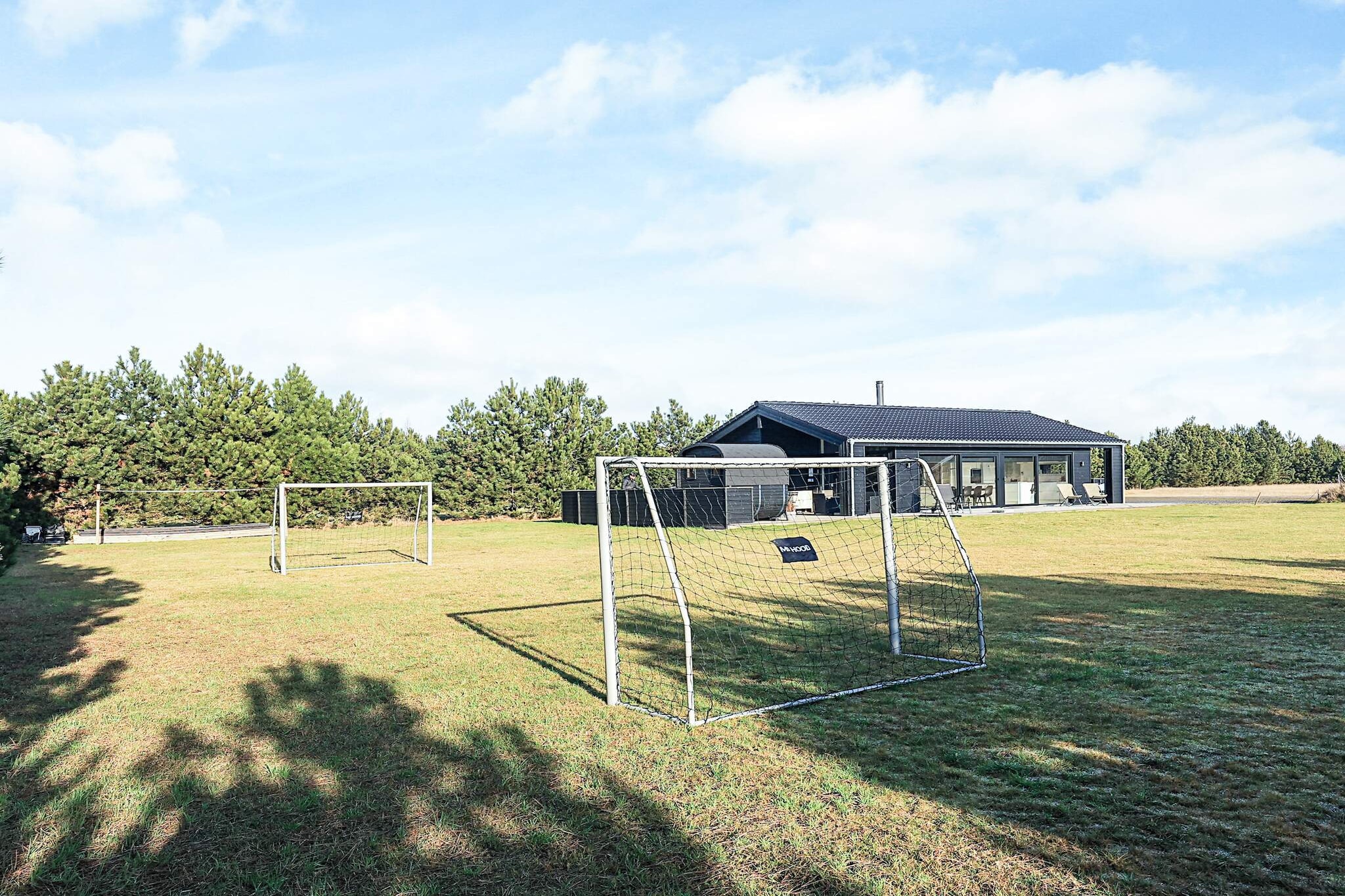 Internet Access DSL, Living room(2x single folding bed), Kitchen(stove(induction), coffee machine, oven, microwave, dishwasher, fridge, fridge-freezer), Living/bed room(TV(german television channels, danish TV channels (DR1 and TV2), norvegian TV channels , swedish TV channels)), bedroom(double bed), bedroom(double bed, cot), bedroom(double bed, bunk bed), bathroom(tumble dryer, washbasin, shower, toilet, washing machine), bathroom(washbasin, shower, toilet), outdoor shower(outside), game computer, Bubble bath(outside, heated, 6 persons), sauna(outside, heated, 4 persons), balcony or terrace, heating(electric), terrace, garden furniture, deckchairs, darts, air to air heatpump