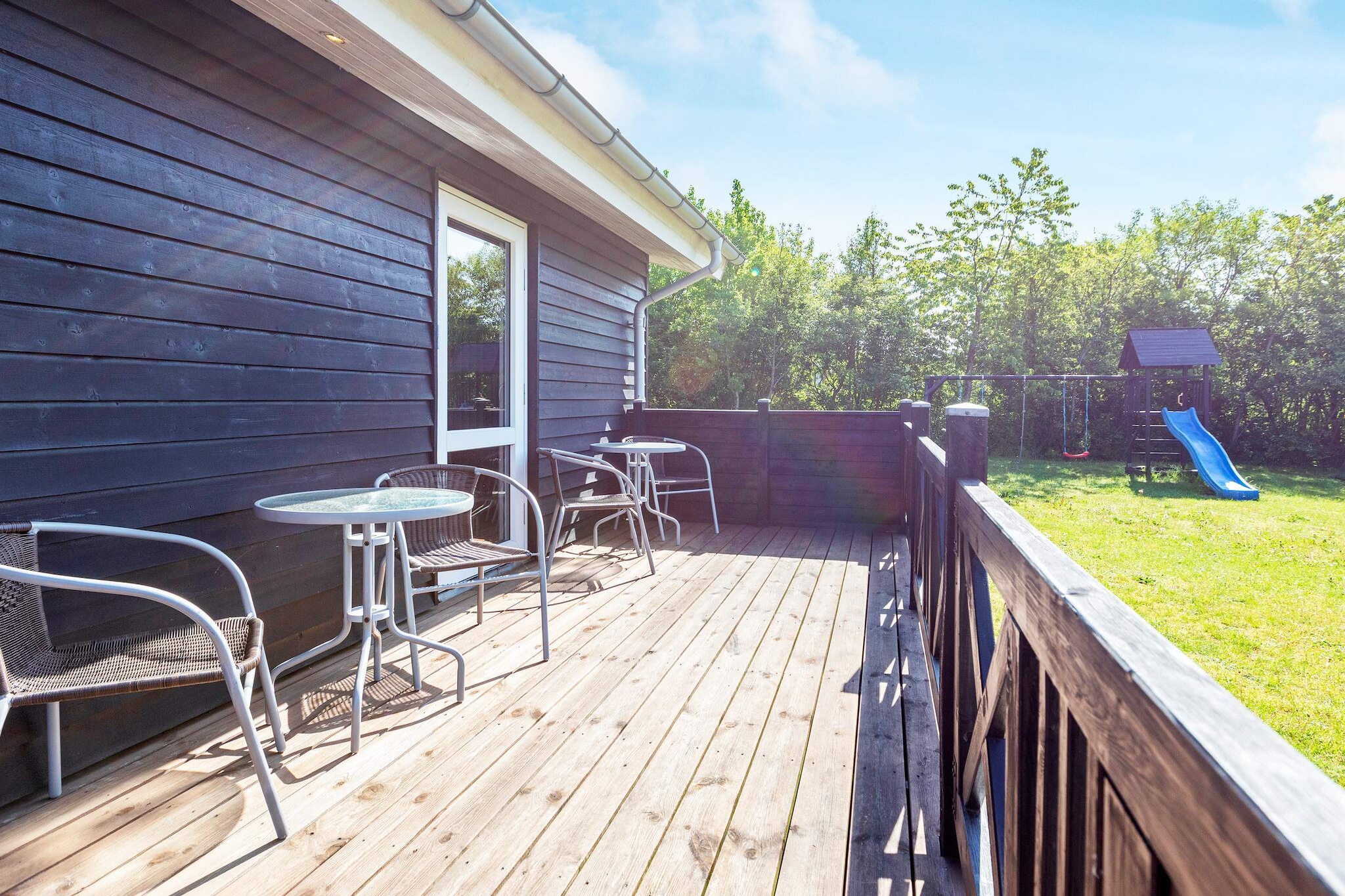 Well-located and well-maintained vacation home suitable for several families, located only about 650 meters from the water at Trend with a child-friendly beach.The cottage's garden offers ample opportunity to enjoy your vacation in peace and quiet, as well as opportunities for ball games and play, including a playground and soccer goals, etc.In addition, there are several cozy corners on the large grounds, which are ideal for reading a good book while the kids play in the garden. The cottage is bright, inviting, and practically furnished with a combined living room/kitchen.The living room has modern furniture, high-speed internet, and a flat-screen TV with Chromecast, where you can stream your own TV services. There is a wood-burning stove for cool summer evenings or rainy autumn evenings. The kitchen includes a ceramic hob, separate oven with grill, extractor hood, microwave, coffee maker, fridge/freezer with a minimum of 60 liters of freezer capacity, and a dishwasher.There is a washing machine and dryer in the house, as well as a high chair and cot for the little ones. Bathroom with shower, bath, toilet, and guest bathroom.The house has five bedrooms, four of which have double beds and one of which has bunk beds. The house has a large, open wooden terrace with good garden furniture, a café set, and a gas grill, where you can enjoy dinner while watching the sun set over the area. In addition, there are additional table and bench sets on the property.Not available for rent to youth groups or construction crews.A refundable deposit might be charged closer to your check-in date. The security deposit ensures a smooth stay and covers any additional services or consumption charges.This deposit covers utilities consumed during your stay and any additional services that may be taken.The final amount will be adjusted based on actual meter readings, actual usage of extra services, and any remaining balance will be refunded within 21 days after checkout.This deposit simply acts as a prepayment for charges that  you would anyways pay for, ensuring a seamless stay and check-out experience.