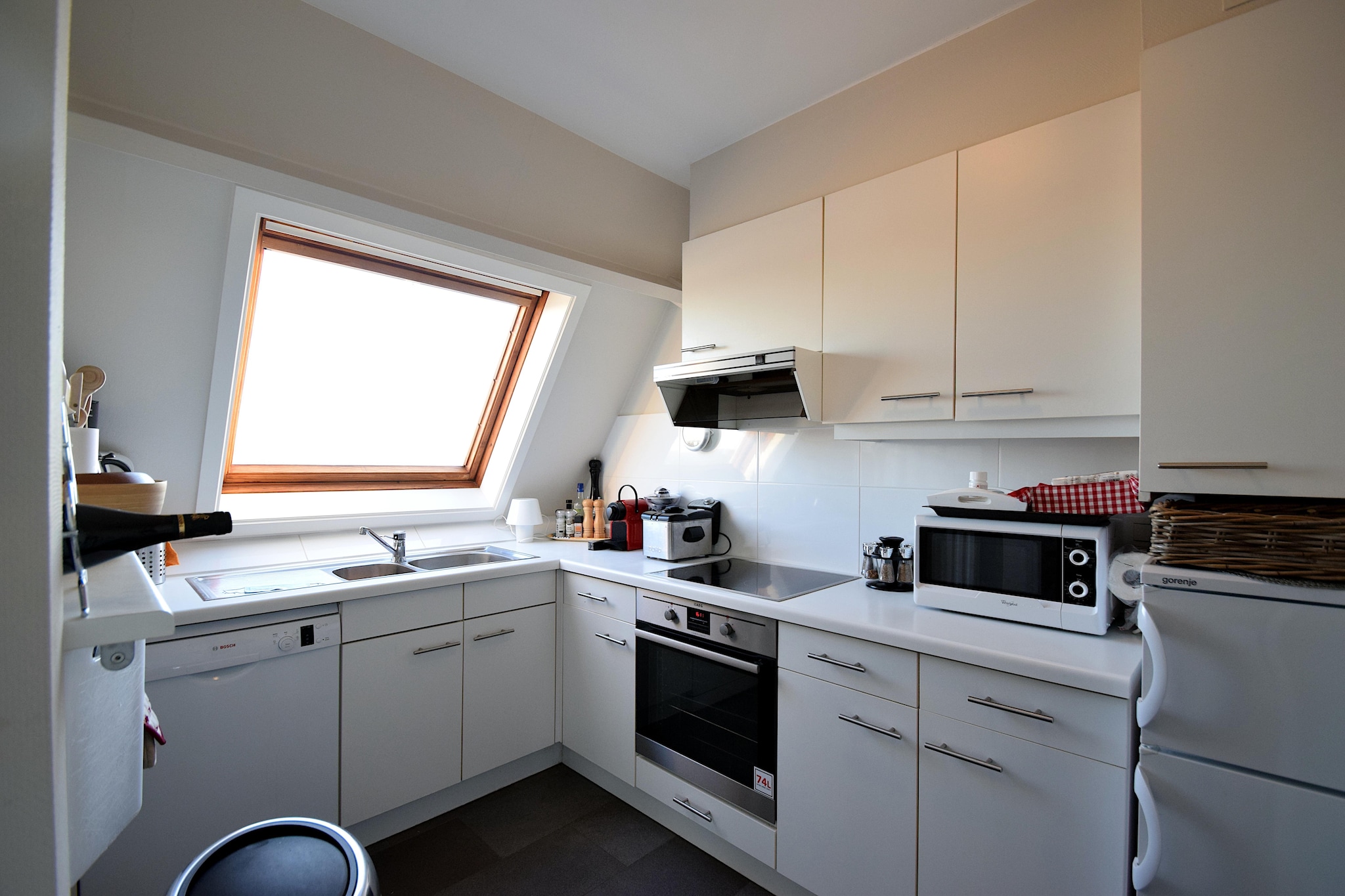 On the 3rd floor: (Kitchen(hob, electric kettle, coffee machine, oven, microwave, dishwasher, fridge-freezer), Living/diningroom(dining table, seating area), bedroom(double bed), walk-through bedroom(double bed), bathroom(shower, washbasin, toilet, hairdryer), toilet(toilet))\n\nDVD player, terrace, bicycle storage, garden furniture, lift, ironing board, iron