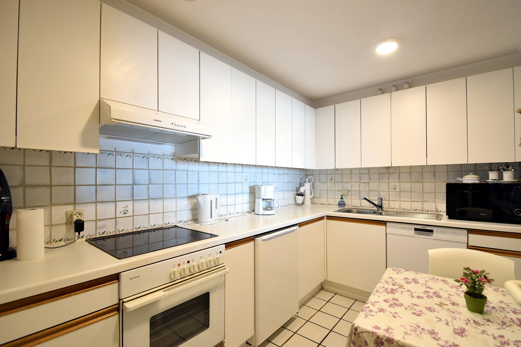 On the 3rd floor: (Kitchen(hob, electric kettle, toaster, coffee machine, oven, microwave, dishwasher, fridge), Living/diningroom(single sofa bed, TV(digital), dining table, seating area, radio), bedroom(double bed), bedroom(double bed), bathroom(bath tub, shower, washbasin, toilet), toilet(toilet))\n\nbalcony, garden furniture, parking