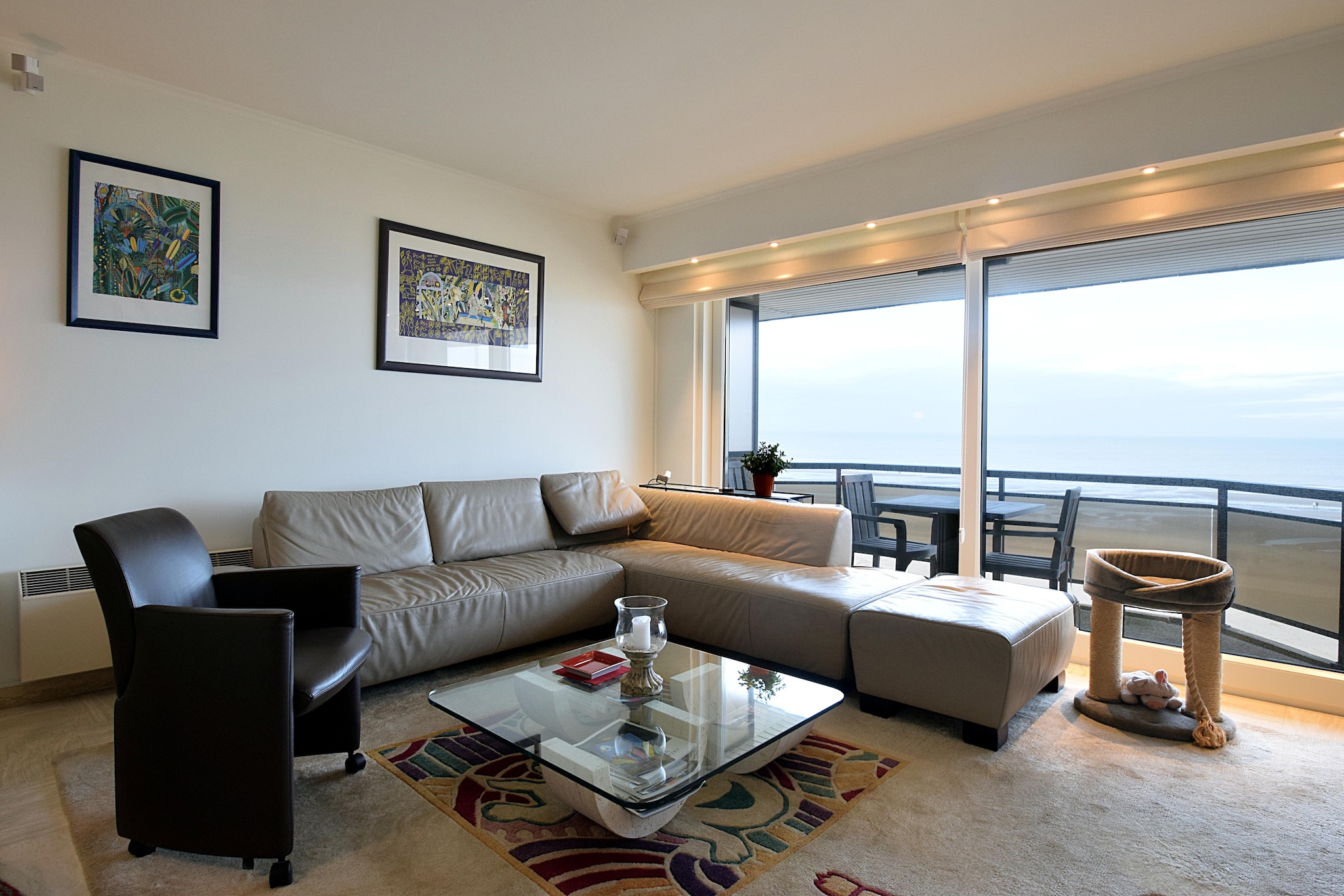 Refined Comfort by the Coast
Step into a stylish and tastefully decorated apartment located in a charming residence along De Haanâ€™s iconic seafront. This cozy first-floor retreat offers all the essentials for a peaceful, luxurious stay. The living and dining space opens to a sea-facing terraceâ€”perfect for your morning coffee or sunset unwinding. With two bedrooms, each featuring an en-suite bathroom (one with a bath/shower combo, the other with a walk-in shower), you'll enjoy comfort and privacy throughout your stay.

Unbeatable Location on Zeedijk
Situated on Zeedijk, just steps from the sandy shoreline, this apartment makes beach days effortless. Whether you're strolling the peaceful promenade, exploring nearby dunes, or relaxing indoors with digital TV and internet, you're always surrounded by the calming rhythm of the coast. While one bedroom offers serene sea views, the secondâ€”enclosed and windowlessâ€”provides a quiet, restful space ideal for deep sleep.

Dining, Parking & More
Enjoy underground parking in the same buildingâ€”an added bonus in busy beach towns. You're a short walk from De Haanâ€™s inviting restaurants, cozy cafÃ©s, and artisanal bakeries. Savor fresh seafood with ocean views or grab a warm waffle from a local vendor.