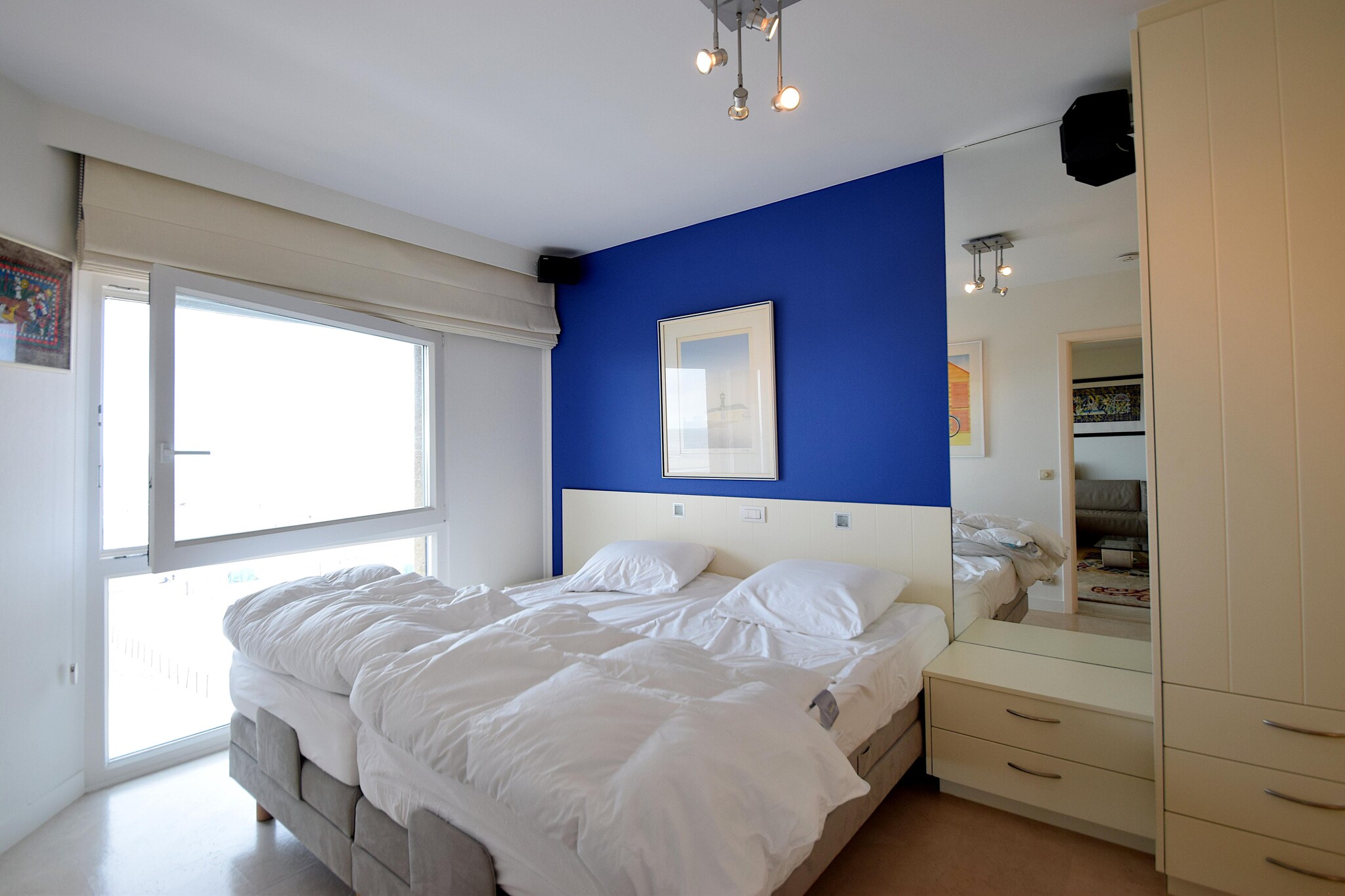 On the 3rd floor: (Kitchen(hob(ceramic), electric kettle, coffee machine, oven, microwave, dishwasher, fridge-freezer), Living/diningroom(TV(digital), dining table, seating area), Bedroom with bathroom(double bed, bathtub with shower, washbasin, toilet, washing machine), Bedroom with bathroom(double bed, shower), toilet(toilet))\n\nDVD player, balcony, garden furniture, parking, lift, ironing board, iron