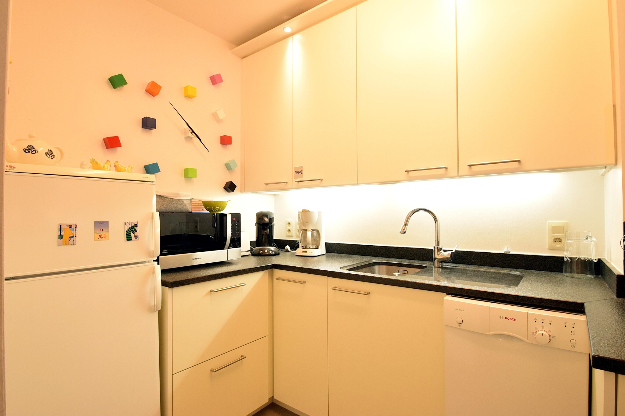 On the 3rd floor: (Kitchen(hob(ceramic), electric kettle, toaster, coffee machine, combination microwave, dishwasher, fridge-freezer), Living/diningroom(double sofa bed(160 x 200 cm), TV, dining table, seating area), bedroom(double bed), bathroom(shower, washbasin, toilet, hairdryer), toilet(toilet))\n\nradio, washing machine, balcony, garden furniture, parking, lift, ironing board, iron