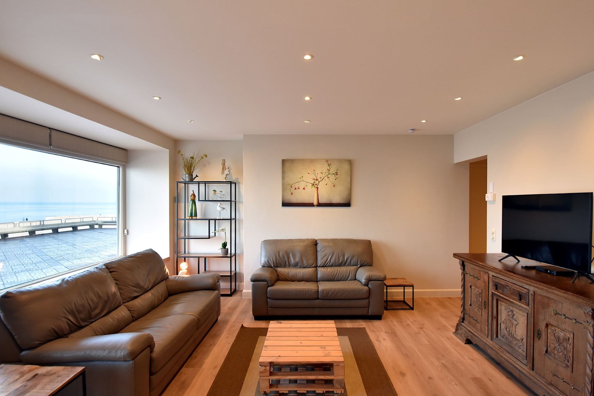 Seaside Comfort with a View
Welcome to your perfect getaway by the coastâ€”this stylish ground-floor apartment offers the best of both worlds: panoramic sea views and ultimate privacy. With its spacious layout and elegant furnishings, it comfortably accommodates up to 8 guests. Whether you're planning a family holiday or a getaway with friends, youâ€™ll love the open living and dining space where everyone can gather, share meals, and relax while watching the waves. Tinted windows at the front ensure complete discretion without compromising the ocean view.

Coastal Living in the Heart of De Haan
Situated directly on the Zeedijk, you're just steps from the beach and close to everything De Haan has to offer. The apartment features three cozy bedroomsâ€”two with bunk beds perfect for kids, and two versatile rooms that convert from double to twin beds. A modern, fully equipped kitchen invites you to cook with ease, and a well-designed bathroom with double washbasins adds to the convenience. The seafront promenade is perfect for morning walks or cycling along the coast.

Dining and Delights Nearby
Step out and discover De Haanâ€™s charming eateries, all within a short stroll. Enjoy Belgian waffles, freshly caught seafood, and beachside drinks at local cafÃ©s. After dinner, return to your serene retreat, unwind with a glass of wine, and let the sound of the sea lull you to sleep.