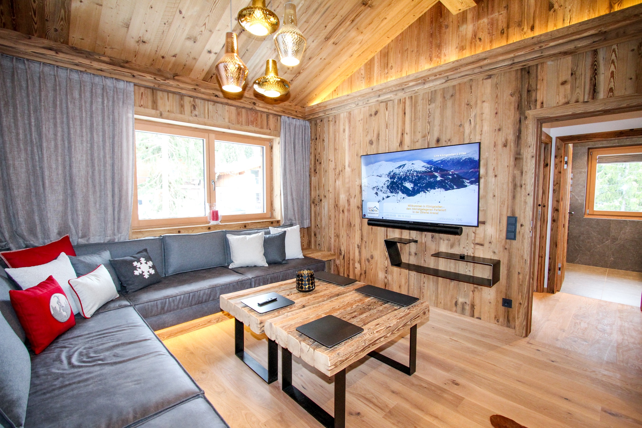 The newly built Chalet Pinzgauer AlmhÃ¼tte impresses with its exclusive furnishings and the perfect location in KÃ¶nigsleiten. You can enjoy your well-deserved holiday with maximum comfort with 12 people. In this 290 mÂ² chalet you will not lack for anything. Another highlight in the chalet is the approx. 50 mÂ² large inclusive wellness area with sauna, steam bath, whirlpool, adventure shower and wellness loungers, as well as a Smart TV. After a strenuous day of skiing or hiking, you can relax and unwind here. Outside there is a heated wooden bathtub for two people, which offers you a relaxing time with a beautiful view. The often stressful everyday life has no place here - you can relax completely. One of the bedrooms is equipped with a free-standing bathtub for extra luxury and a few private relaxing hours. The spacious kitchen, which is located on the first floor, offers space to let the culinary art run free. In keeping with the typical Austrian style, the house is equipped with original Gmundner ceramic crockery. The large dining table with a view of the ambience fireplace offers plenty of space to review your experiences of the day at dinner. From the kitchen you can reach the 17 mÂ² balcony terrace, which invites you to a movie night together with an outdoor Smart TV. From here you can reach the Eberharter's Almdorf lift in just a few steps, which gives you quick access to the Zillertal Arena. In summer you can start your hikes directly at the house.

About Belvilla

At Belvilla, you experience holidays exactly the way you want. Choose from an extensive range of holiday homes, apartments and caravan parks from Europe to Florida. From a cabin by the Norwegian fjord to an exclusive villa on the CÃ´te d'Azur, and from an apartment in Rome to a country estate in Tuscany. At Belvilla you will find the perfect holiday home for an unforgettable time with your family, partner or friends. You will also find holiday homes for larger groups, spread across various regions in Europe.

Belvilla offers a wide variety of holiday homes: small and cosy with a sauna or spacious with an outdoor pool, roof terrace and numerous bedrooms. At Belvilla, for example, you can choose from holiday homes in prime locations, with luxury amenities and homes particularly suitable for families. Of course, many holiday homes also have a space reserved for your dog. You can choose from practical holiday homes in popular holiday destinations, city houses in cosmopolitan cities such as Venice or Rome, dreamy holiday homes in top locations and spacious holiday homes with unique furnishings. Besides holiday homes by the sea, Belvilla also offers holiday homes with swimming pool and/or wellness facilities.