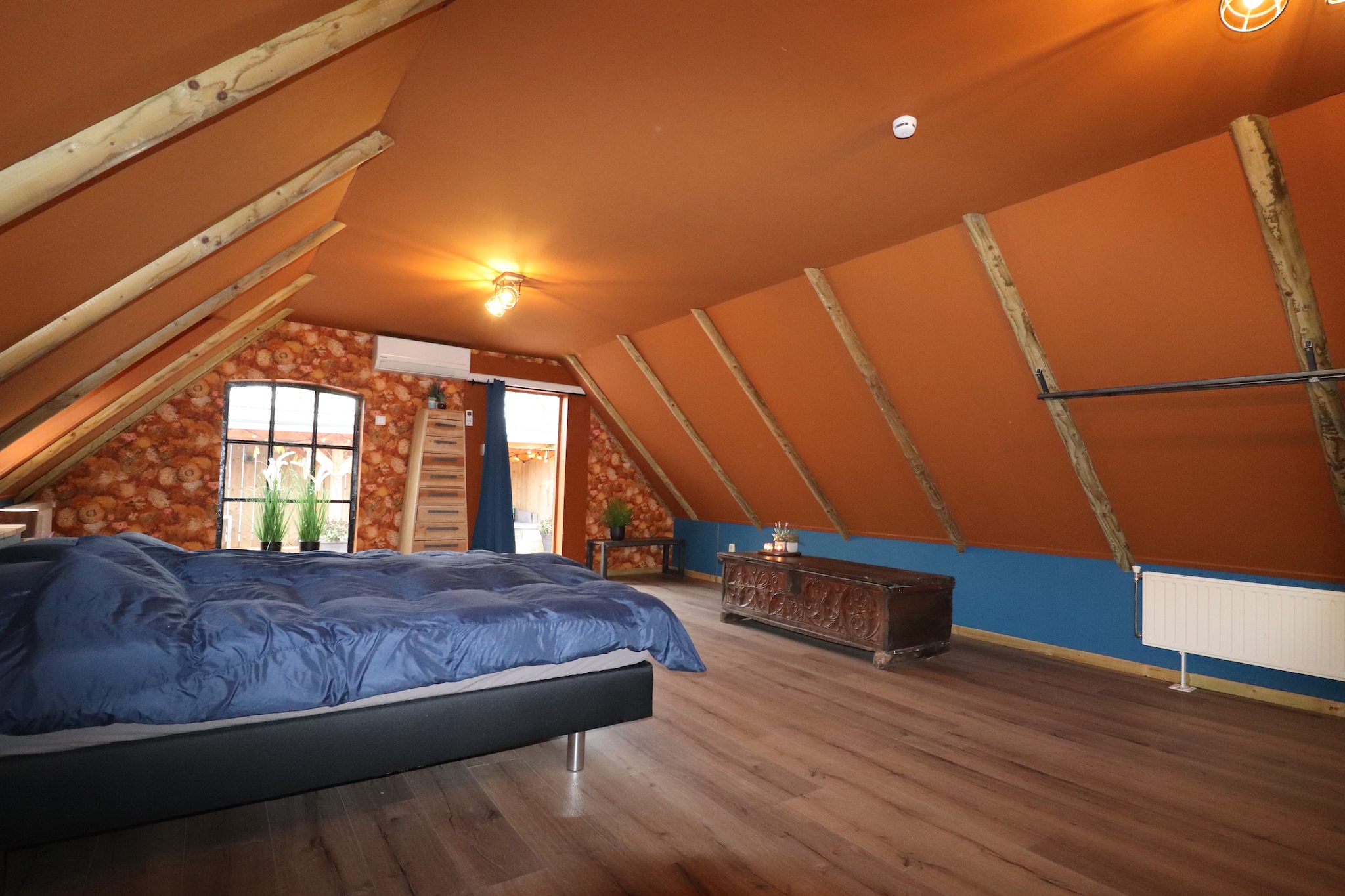 Ground floor: (hallway(tumble dryer, washing machine), Living room(double folding bed, TV, stove(wood), seating area(5 persons), air conditioning), open kitchen(dining table(4 persons), hob(5 ring stoves, gas), electric kettle, coffee machine(cups), oven, microwave, dishwasher, fridge), bedroom(double bed(boxspring), air conditioning), bathroom(shower, washbasin, toilet))\n\ngarden doors, terrace(roofed), roof terrace, garden, garden furniture, terrace heater