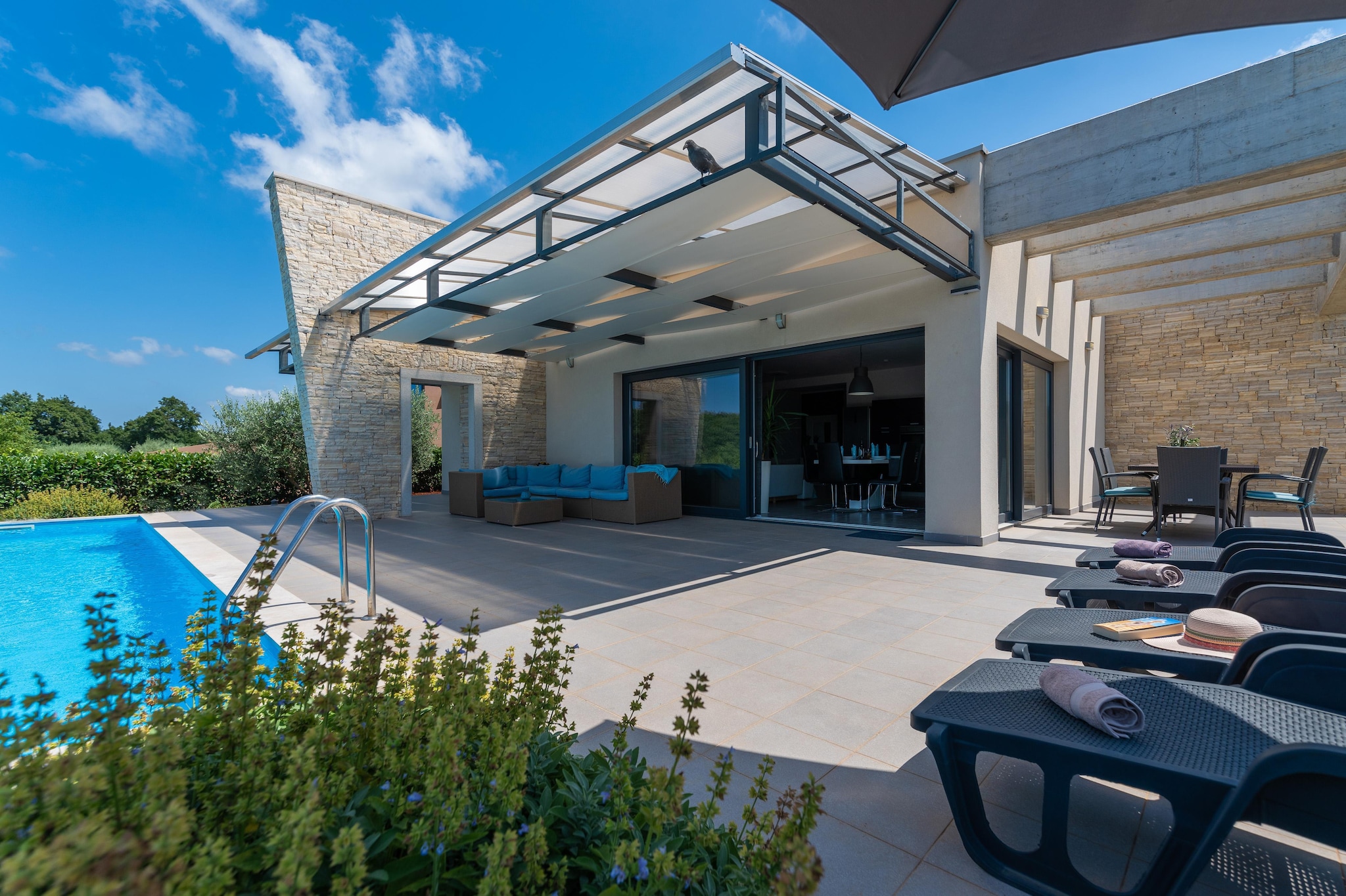 Modern villa with pool, covered terrace and sea view