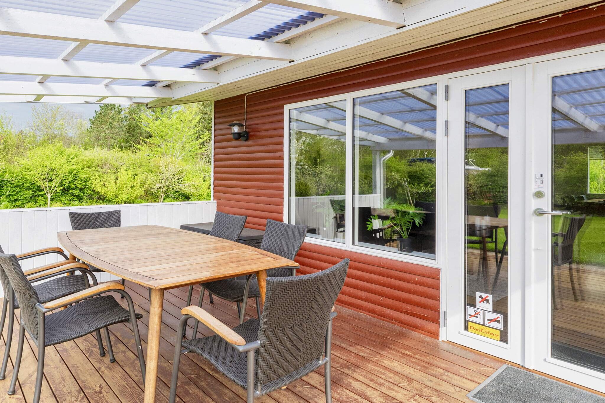 This traditional holiday home is situated on a 1,400 m² natural plot in Klitgårds Fiskerleje, offering privacy and a peaceful setting surrounded by trees. The house features three bedrooms: one with a double bed, a second with two single beds, and a third with a double sofa bed, providing comfortable accommodation for families or small groups. The living room is bright and welcoming, equipped with free Wi-Fi, a flat-screen TV, a cozy fireplace, and comfortable furnishings for relaxing evenings. The bathroom was fully renovated in 2022 and includes a walk-in shower with rain showerhead, WC, and underfloor heating for added comfort. The kitchen is modern and well-equipped with a fridge-freezer, dishwasher, coffee machine, and washing machine, making it easy to prepare meals and enjoy family gatherings in a practical setting. Outside, a large, wind-protected wooden terrace awaits, featuring both a covered and an open area for outdoor dining, sunbathing, or relaxing in the fresh air. The property also has a spacious lawn and trees surrounding the house, ensuring privacy. For added convenience, there is a charging point for electric cars on-site. The house is not available for rental to youth or trades groups.A refundable deposit might be charged closer to your check-in date. The security deposit ensures a smooth stay and covers any additional services or consumption charges.This deposit covers utilities consumed during your stay and any additional services that may be taken.The final amount will be adjusted based on actual meter readings, actual usage of extra services, and any remaining balance will be refunded within 21 days after checkout.This deposit simply acts as a prepayment for charges that you would anyways pay for, ensuring a seamless stay and check-out experience.