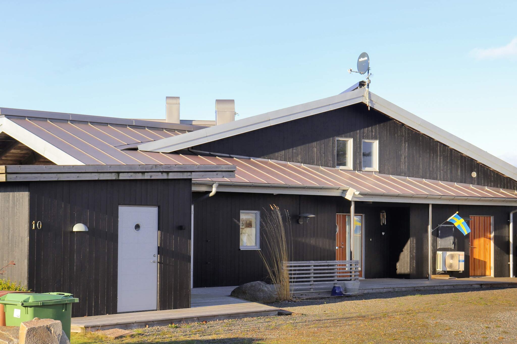 A famous architect has designed this holiday home with a high standard at Bua strand north of Varberg. The house is located high and has an adorable view of the sea and the salt-splashed cliffs. The area is quiet and peaceful with many walking paths along the sea. Here you have both rock baths and small sandy beaches. Just nearby is the cozy harbor in Bua with its boathouses, the fishing port and the pleasure boats. A holiday home for those who only settle for the highest quality. Perfect for two families or friends who want to vacation together. On the ground floor there is a large open kitchen with kitchen island and dining area. There are three double bedrooms and two bathrooms with shower and laundry room. The large bright living room is open up in the nock. Large windows and the opportunity to open up the glass sections to the sea side. A room that has everything you want from comfortable seating and a fantastic view. On the terraced side of the house facing the sea there are several nice patios, some under roof, and comfortable outdoor furniture and barbecue. You have the morning sun on the entrance side of the house. Perfect for morning coffee. Upstairs there is another bedroom with three single beds and a toilet. A smaller open living room with seating and modern TV as well as a larger living room with sofas and an extra bed. The whole house has a comfortable underfloor heating and the plot accommodates all the family's activities. Down by the small boat berth is your rowing boat. The sea is free to fish in. In the small community of Bua there is most of it for your holiday. In the picturesque harbor there is a fish shop with fresh seafood, as well as ready-made dishes. In summer, the boathouses are open with delicious dishes in a wonderful atmosphere. Right next to the harbor is Bua's largest beach with a fine sandy beach and views of the harbor entrance and its passing sailboats. On the other side of the mane is a smaller familiar beach. From Bua you are close to the beautiful summer town of Varberg with a throng of people, taverns, cafes and dance venues, everything that belongs to a summer town. The massive Varberg Fortress guards the entrance to the harbor and is visible from afar. Just outside Varberg is GetterÃ¶n, one of Sweden's most famous bird sanctuaries. Another nice excursion destination is Ã…kulla beech forests and for those who are technically interested, it is not far to the World Heritage Site Grimeton. If you are interested in golf there is a fine golfcourse at Klosterfjordens GK's in Ã…skloster. The house does not rent to youth groups. Welcome to a quality house with unique character and high standard.