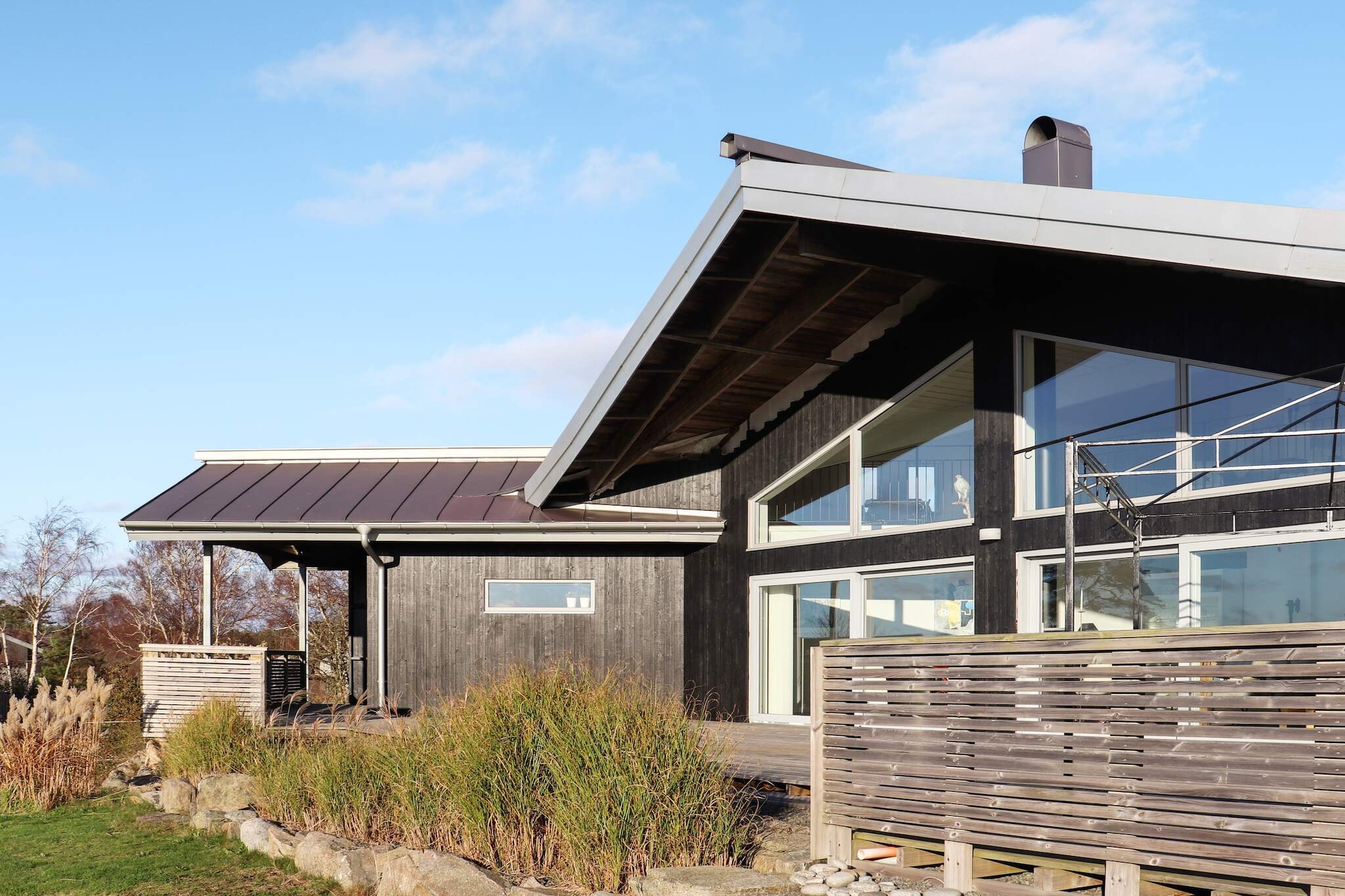 open kitchen(cooker(electric), hood, coffee machine, microwave, dishwasher, fridge-freezer, high chair), Living/bed room(TV), bedroom(double bed), bedroom(double bed), bedroom(double bed), bedroom(3x single bed), bedroom(single folding bed), bathroom(washbasin, shower, toilet), bathroom(washbasin, shower, toilet), bathroom(washbasin, toilet), tumble dryer, washing machine, heating(electric), courtyard(garden furniture), garden, parking, air to air heatpump