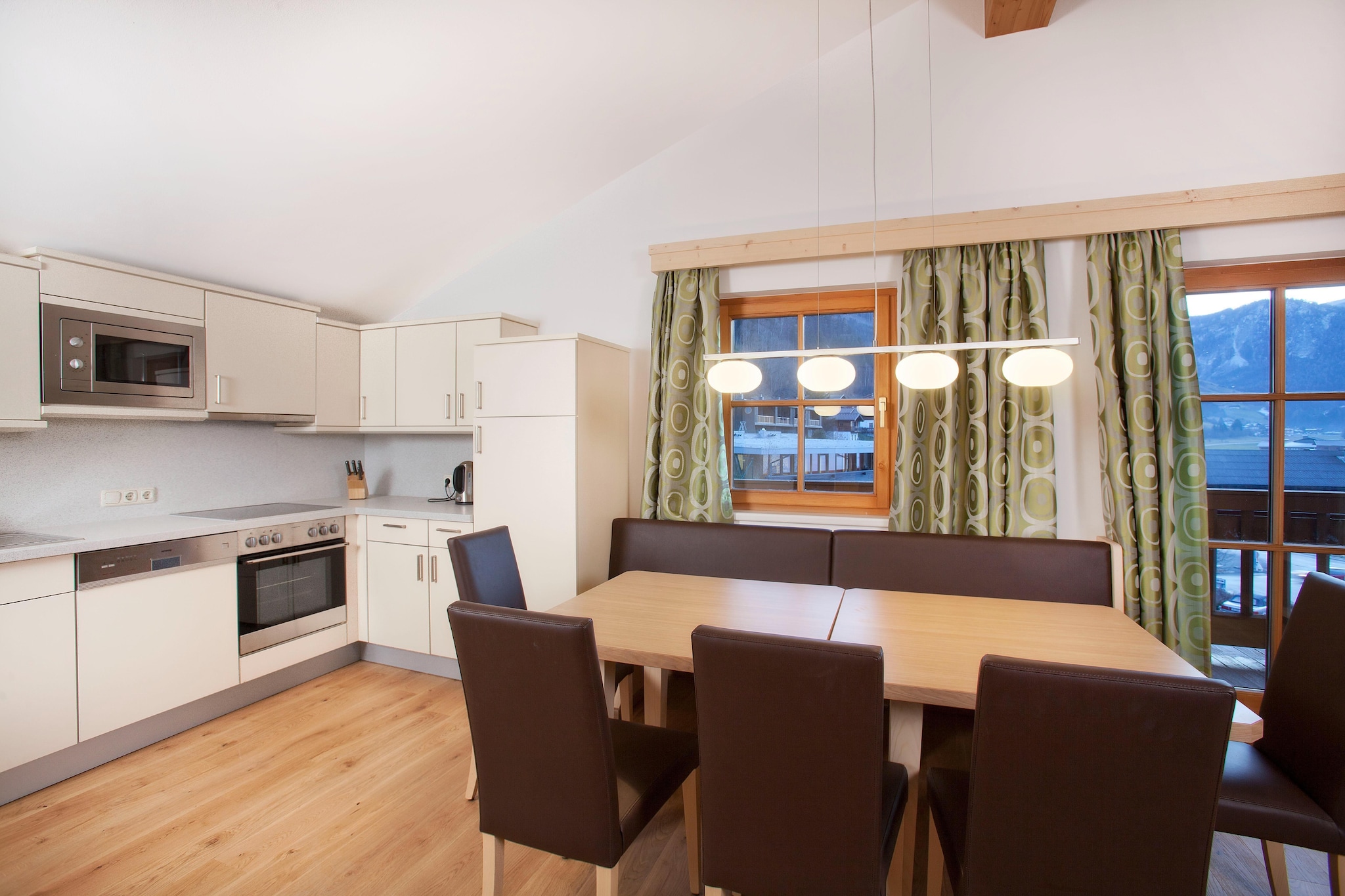 On the 2nd floor: (Entrance, Living room(double sofa bed, TV, seating area), open kitchen(dining table, hob(4 ring stoves, ceramic), electric kettle, coffee machine, oven, microwave, fridge(+ freezer)), pantry, bedroom(double bed), bedroom(single bed, double bed), bathroom(shower, toilet), bathroom(shower, toilet))\n\nski storage(shared with other guests), tumble dryer(shared with other guests, paid), washing machine(shared with other guests, paid), balcony, parking, parking, swimming pool(shared with other guests)