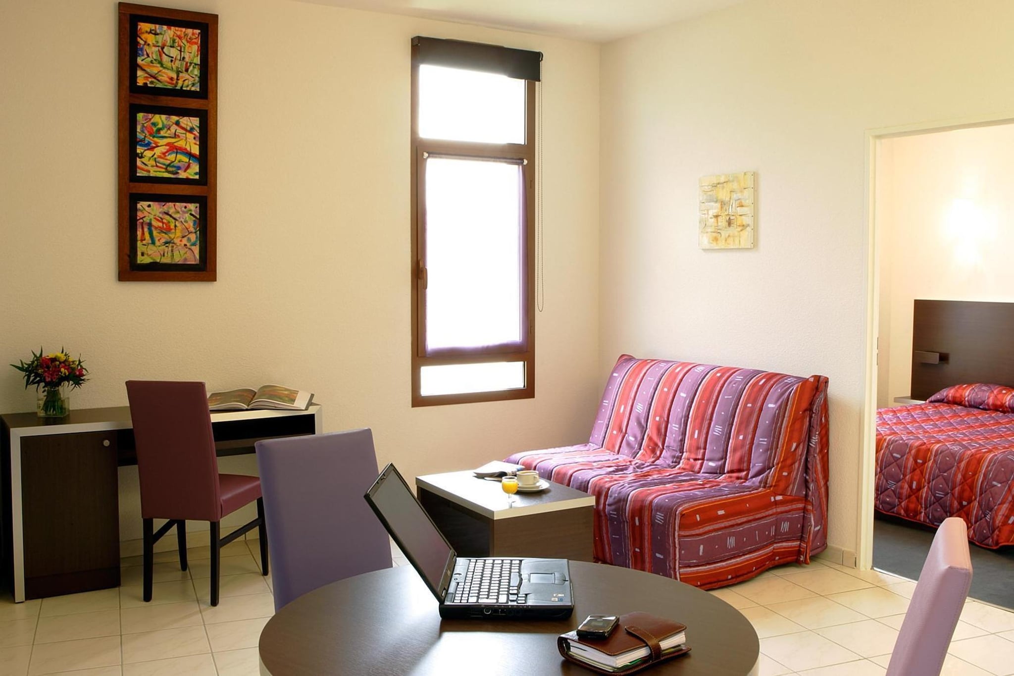 Set in the historic surroundings of Carcassonne, this welcoming apartment places you close to one of France’s most iconic medieval landmarks. With the famous fortified cité, charming streets and riverside walks nearby, the location offers a wonderful base for travellers wanting to combine cultural discovery with relaxed southern French living.

Inside, the apartment is designed to comfortably accommodate up to four guests. The living and dining area provides a cozy space to relax after a day of sightseeing, featuring comfortable seating and a TV. A basic-equipped kitchen allows guests to prepare simple meals during their stay. The sleeping arrangement includes a double bedroom along with a double sofa bed in the living room, while a bathroom with a shower provides everyday convenience. Wi-Fi and air-conditioning keep guests connected and comfortable throughout their visit.

The property also offers pleasant outdoor areas with seating that allow for quiet moments in the fresh air, whether enjoying morning coffee before exploring the city, alfresco meals or unwinding in the evening after a day of walking through Carcassonne’s historic streets. Parking adds convenience for guests arriving by car.

From here, the famous medieval citadel of Carcassonne is easily accessible and perfect for exploring ancient walls, towers and narrow cobbled lanes. Nearby cafés, restaurants and local markets offer plenty of dining options, while the Canal du Midi invites scenic walks and cycling routes. The location provides an ideal base for discovering the rich history and charm of southern France.