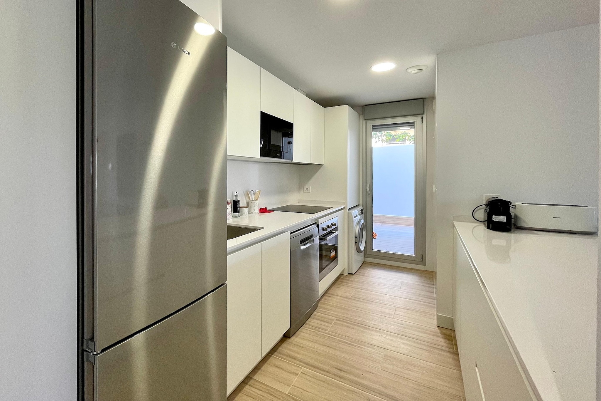 Ground floor: (Entrance(reachable from the outside)(lift), open kitchen(hob, electric kettle, toaster, hood, coffee machine(cups), oven, microwave, dishwasher, fridge-freezer, washing machine, Juicer), Living/diningroom(double sofa bed, TV(flatscreen, smart TV, international television channels), dining table, seating area, balcony or terrace), bedroom(single bed, single bed), Bedroom with bathroom(double bed, bathtub with shower, washbasin, toilet, bidet, hairdryer), bathroom(shower, washbasin, toilet), heating, air conditioning, terrace)\n\nfitness room(shared with other guests)(fitness equipment), garage(shared with other guests, reachable from the outside), garden doors, garden furniture, swimming pool(shared with other guests, outside, including separate children’s swimming pool (depth 50cm), opened from 1/2 Jun upto and including 1/2 Sep)