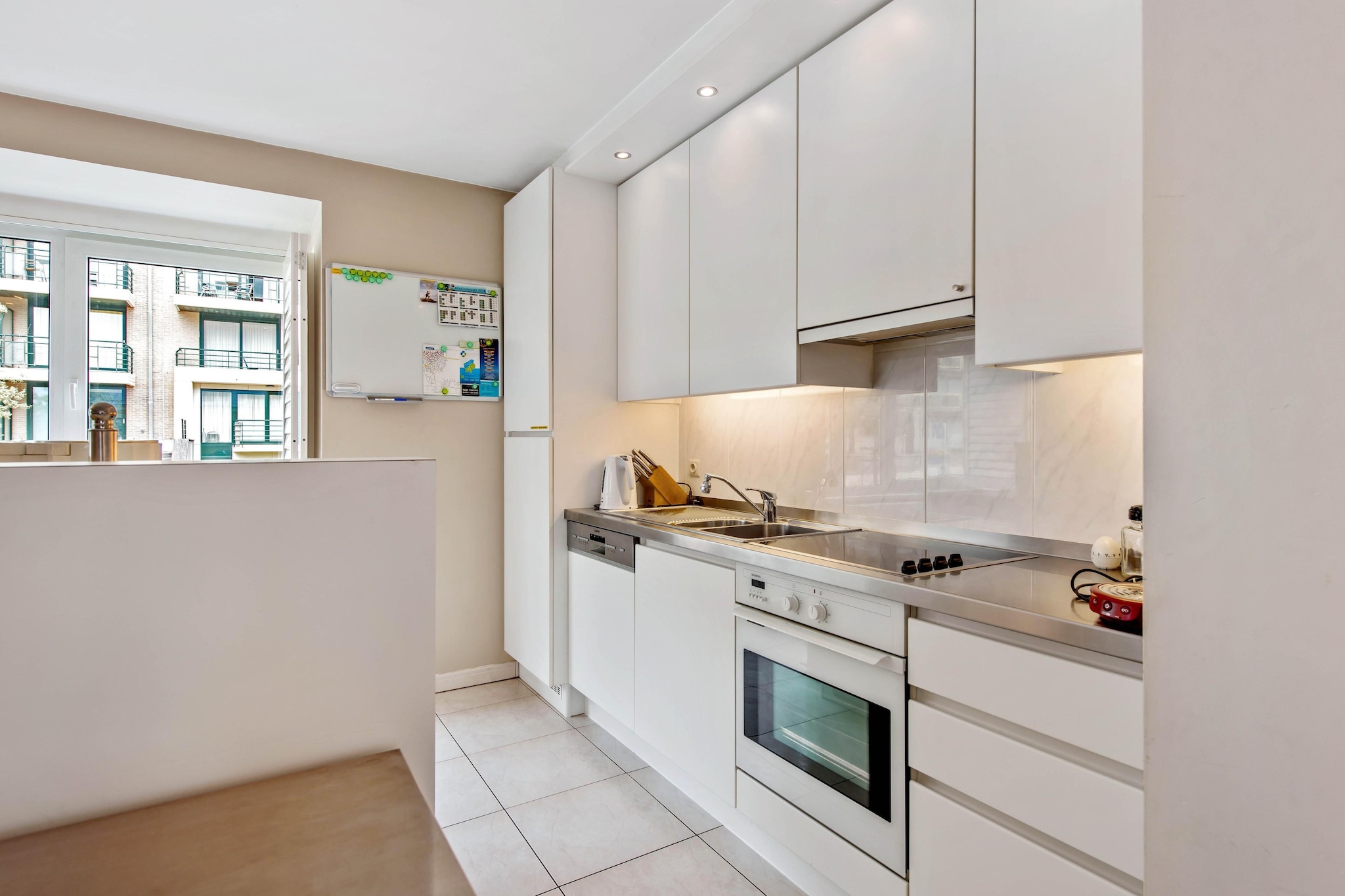 Ground floor: (Living room(TV, dining table, seating area), Kitchen(hob, electric kettle, toaster, hood, coffee machine, oven, microwave, dishwasher, fridge-freezer), bedroom(double bed(two single duvets, 160 x 200 cm)), Bedroom with bathroom(double bed(two single duvets, 160 x 200 cm), shower, washbasin), bathroom(shower, washbasin), toilet(toilet))\n\ngarage, washing machine, balcony, garden furniture, lift, high chair, baby crib(free)