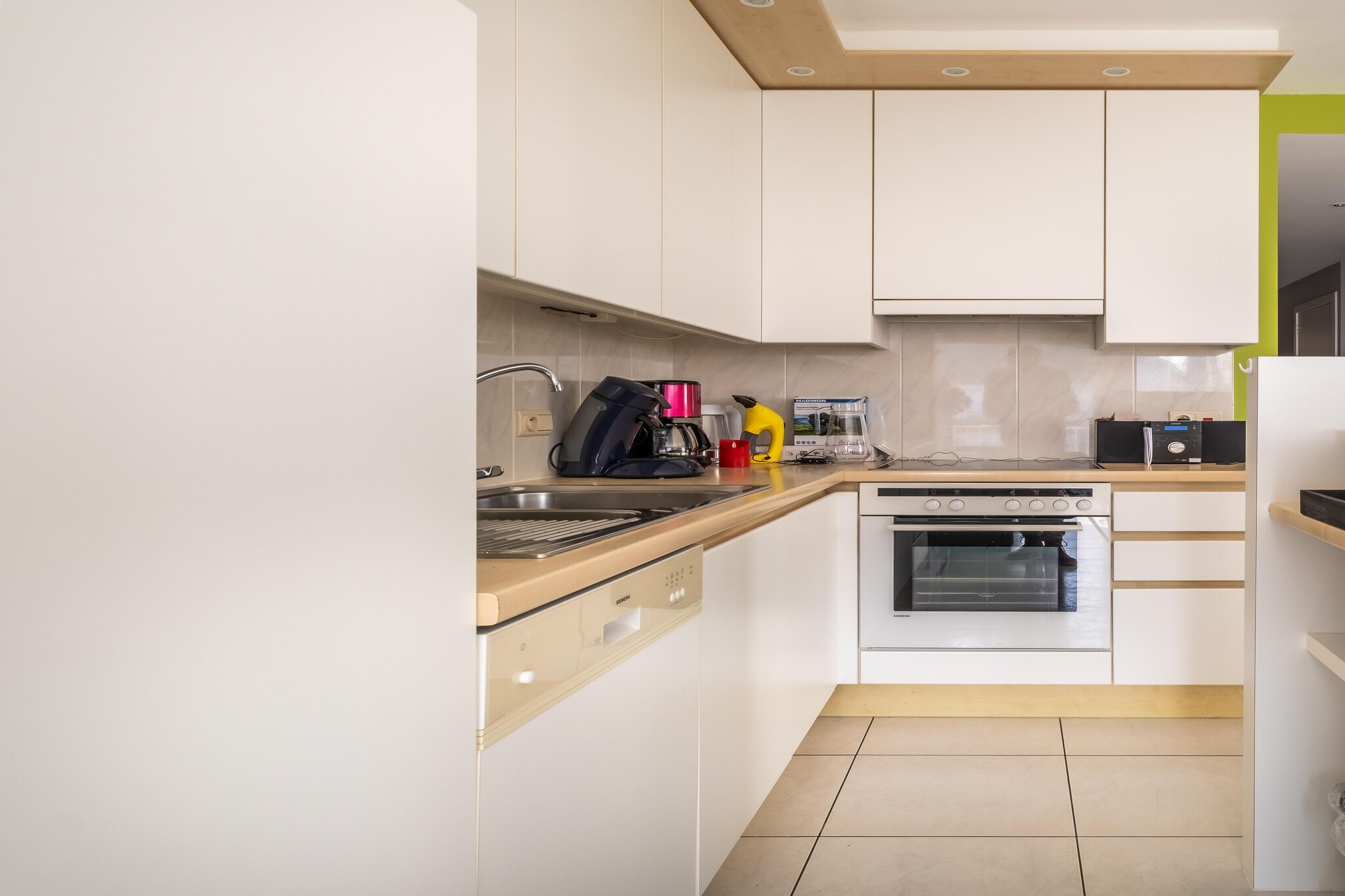 On the 1st floor: (open kitchen(hob(ceramic), electric kettle, toaster, hood, coffee machine, oven, dishwasher, fridge(+ freezer), Hand blender), Living/diningroom(double sofa bed, TV(flatscreen, digital), dining table(6 persons), seating area, balcony), bedroom(double bed(twin duvet, 160 x 200 cm)), bedroom(3-person bunk bed(duvet, 140 x 200 cm)), bathroom(bath tub, washbasin, washing machine), toilet(toilet))\n\nheating(electric), bicycle storage, garden furniture, parking, lift, lift, ironing board, iron