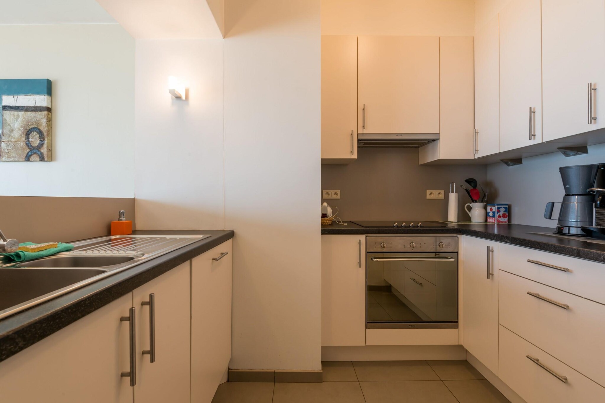 On the 4th floor: (Kitchen(hob(ceramic), electric kettle, toaster, hood, coffee machine(cups, pads), oven, combination microwave, dishwasher, fridge(+ freezer), Hand blender), Living/diningroom(TV(flatscreen, digital), dining table, seating area), bedroom(double bed(twin duvet, 160 x 200 cm), washbasin, balcony), bedroom(double fold-away bed(twin duvet, 140 x 200 cm), bunk bed(duvet, 80 x 200 cm), washbasin), bathroom(shower, washbasin), toilet(toilet))\n\nheating(central, gas), garden furniture