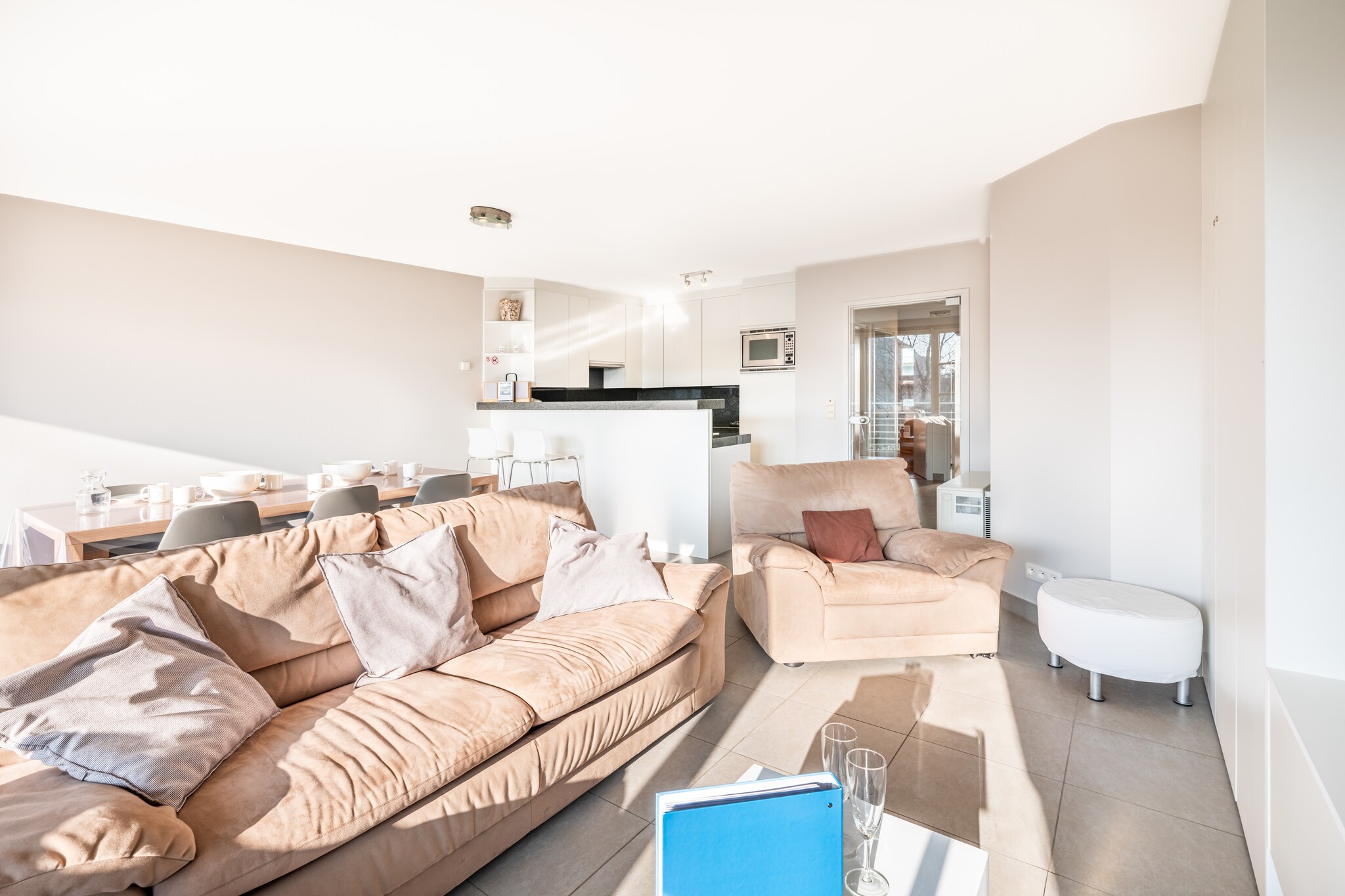 On the 1st floor: (Kitchen(hob(ceramic), coffee machine, dishwasher, fridge(+ freezer)), Living/diningroom(TV(flatscreen, digital), dining table, seating area), bedroom(double bed), bedroom(bunk bed, bunk bed), bathroom(bathtub with shower, shower, washbasin, washbasin))\n\ngarage, washing machine, balcony, garden furniture, lift