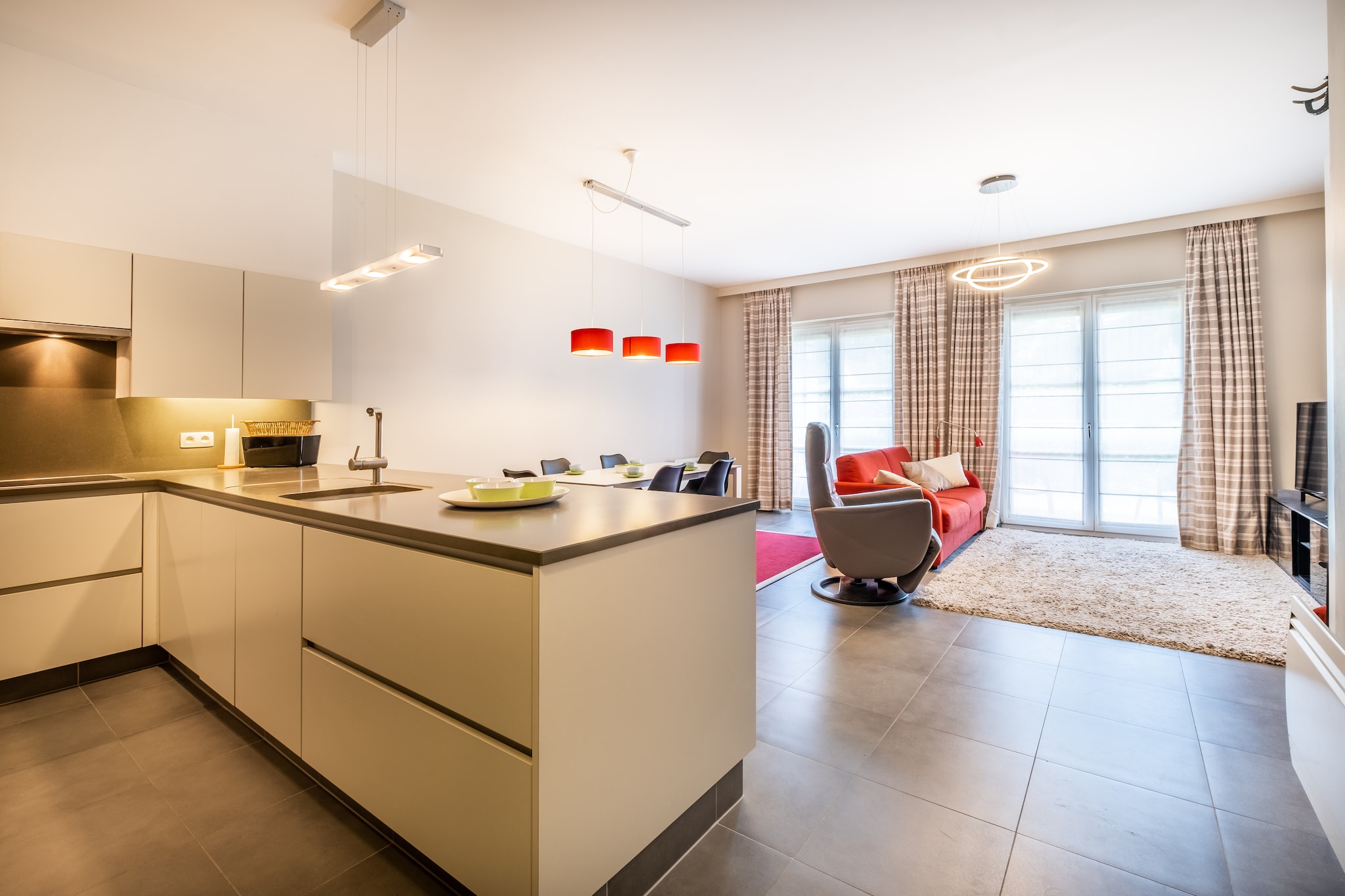 Ground floor: (Kitchen(hob(ceramic), electric kettle, toaster, coffee machine, oven(steam), grill, combination microwave, dishwasher, fridge(+ freezer), Blender, Hand blender), Living/diningroom(TV(flatscreen, digital), dining table, seating area), bedroom(single bed(duvet), bunk bed(duvet)), bedroom(double bed(twin duvet)), bathroom(shower, washbasin), toilet(toilet))\n\ngarage, washing machine, heating, terrace, garden furniture, lift, iron