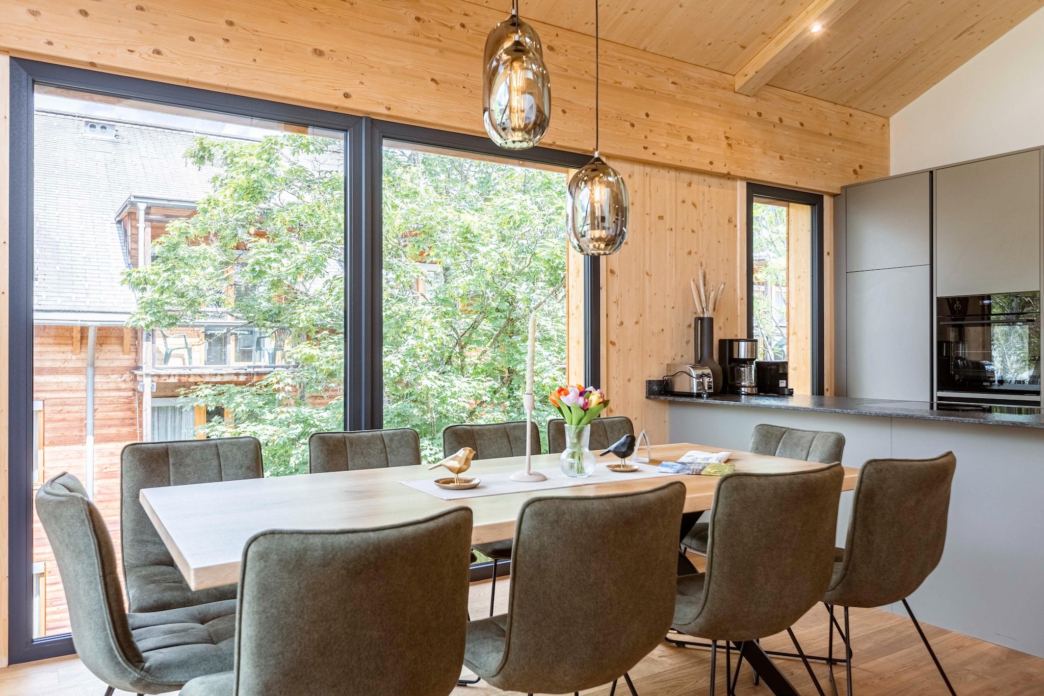 "Discover unparalleled luxury in this sophisticated 117m² penthouse, perfectly designed for up to 10 guests. Situated just a few meters from the Kreischberg gondola lift, this penthouse offers an exceptional blend of modern comfort and alpine elegance. The penthouse features four beautifully appointed bedrooms, including three with sumptuous box-spring double beds and one with a double bed plus a convenient bunk bed. The accommodations are complemented by two stylish bathrooms with invigorating rain showers, an en-suite bathroom, and a separate guest toilet. The penthouse’s standout feature is its luxurious private spa area. Unwind in the in-house Finnish sauna or indulge in the outdoor bathtub for a truly relaxing experience. 
The expansive living area invites relaxation with its cozy seating arrangement and a flat-screen TV, ideal for winding down after a day of adventure. Step through the sliding doors onto the balcony to soak in breathtaking views of the Kreischberg. The modern kitchen is a chef’s dream, fully equipped with high-quality cutlery, cookware, a ceramic hob, oven, microwave, fridge with freezer compartment, and dishwasher. Additional amenities include a kettle, toaster, and a Nespresso coffee machine. To ensure a smooth start to your stay, a small starter set with dishwasher tabs, dishwashing liquid, sponge, garbage bags, cleaning supplies, and a tea towel is provided. Complimentary Wi-Fi ensures you stay connected throughout your stay, and the MurauCard (summer) adds extra value with local perks and activities. "