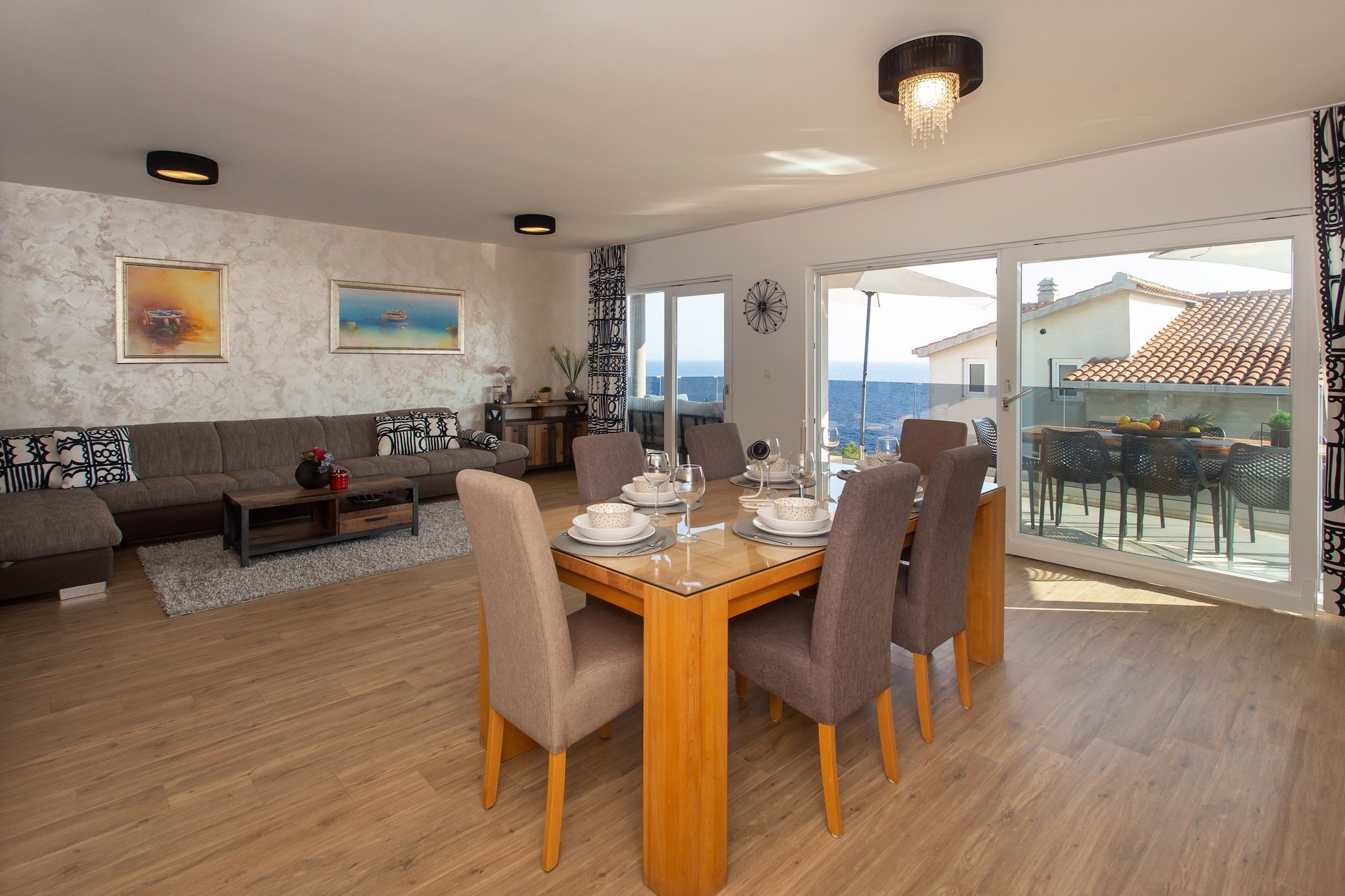 Apartments Aqua is located in Okrug Gornji located in the beautiful traditional village Okrug Gornji on the Island of Čiovo which is connected with the mainland to historic Trogir. 

Spacious terrace fitted with sun beds and parasols as well as a common seasonal outdoor swimming pool and a shared garden are at your disposal.

Private parking is provided.

Outdoor shower, hot tub and gym are at guests disposal.

Seasonal heated outdoor pool is opened from 01.05.-30.10.

This two bedroom apartment with terrace and sea view is perfectly fit for up to six people. It features free air conditioning as well as  LCD TV. The open space living room comes with sofa and sitting area, and it's combined with the equipped kitchen and dining area. The private bathroom comes with shower and toilet.
Hair dryer as well as linens and towels are at your disposal.

If you want to spend your vacation in a peaceful and quiet environment, far from the city crowds, and also to have nearby all you need during your holidays, Apartments Aqua
is the best choice for you. Beach is only 70 meters from the property! Market is 80 m while restaurant and coffee bar are 400 m away.

Split airport is only 7 km away.