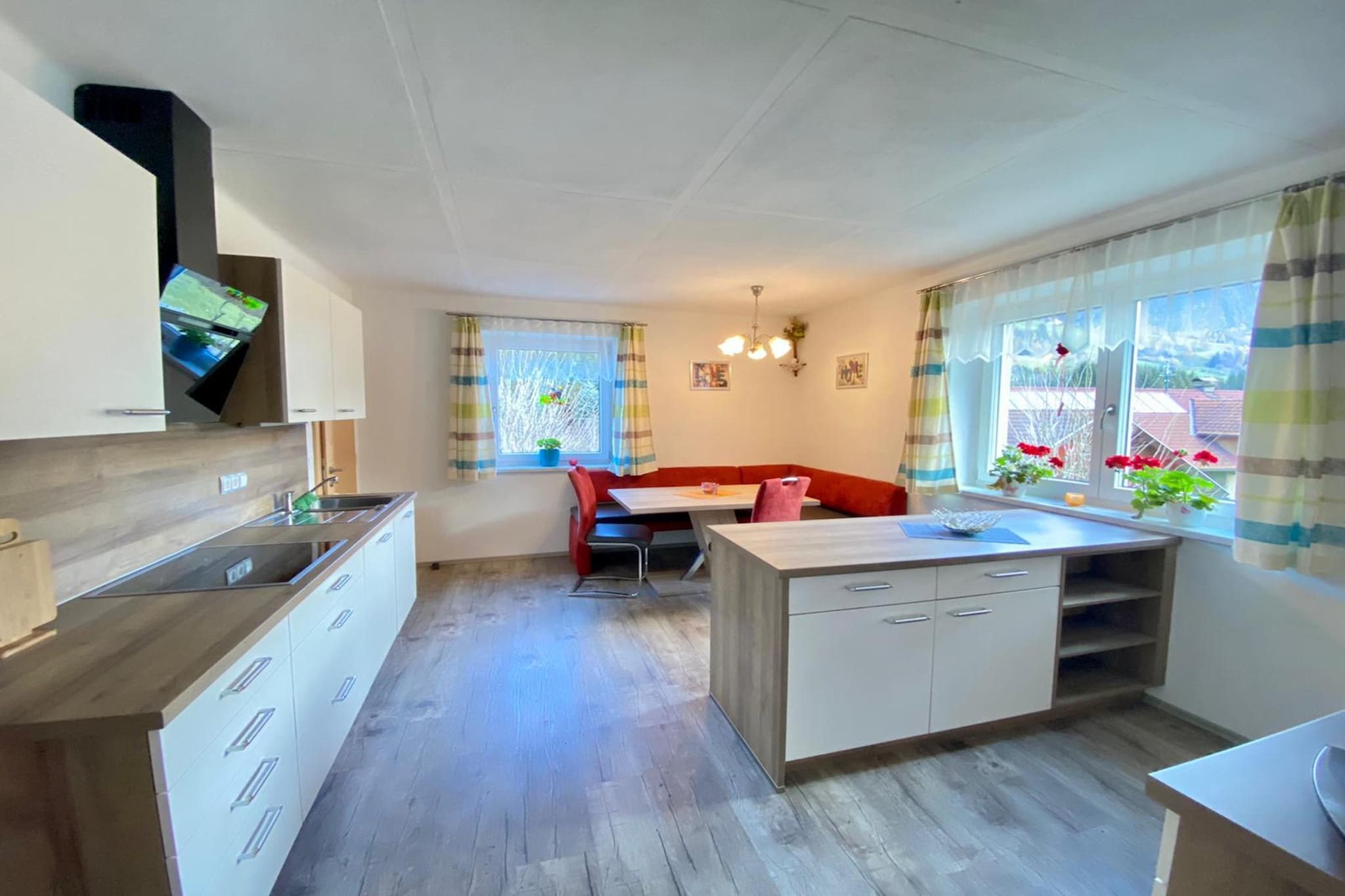 Ground floor: (Living room(TV, seating area), Kitchen(cooker, coffee machine, oven, microwave, dishwasher, fridge), bedroom(single folding bed, double bed), bedroom(single folding bed, double bed), bedroom(double bed), bathroom(shower, washbasin, washbasin, toilet), toilet(washbasin, toilet))\n\nski storage, grill, parking