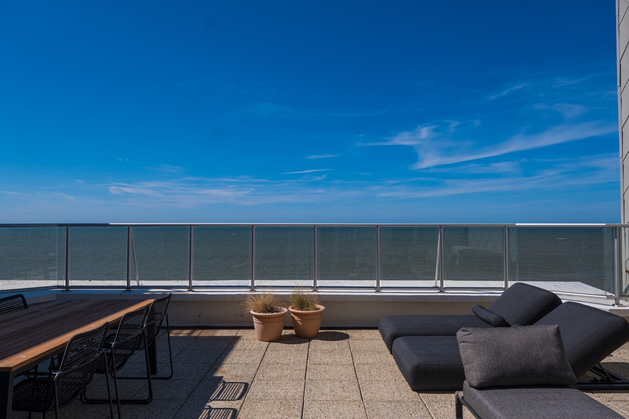 Experience ultimate luxury in this breathtaking penthouse on the 8th floor, the most spectacular apartment in Middelkerke, featuring phenomenal sea views and a private rooftop terrace that showcases the sunset in all its glory. This unique and fully renovated gem offers 2 spacious bedrooms, each with comfortable double beds, combining elegance, comfort, and an unbeatable location on the seafront.  The bright and spacious living room boasts floor-to-ceiling windows providing a stunning panorama of the sea and direct access to the expansive rooftop terrace, perfect for enjoying a cocktail at sunset. The bedrooms also open onto a sunny terrace. The modern open kitchen, bathroom with walk-in shower, and separate toilet complete this luxurious retreat.  The penthouse is equipped with air conditioning, and the lift takes you to the 7th floor, with a few elegant steps leading to this exclusive pinnacle of luxury. For added convenience, a garage is included in a nearby building.  Located in the heart of the seafront, close to shops, restaurants, and public transport, this penthouse offers an unparalleled combination of privacy, comfort, and spectacular sea experience. A stay here is nothing short of a dream holiday on the Belgian coast.  Wifi: yes - garage: included - sheets: bring your own - towels: bring your own.