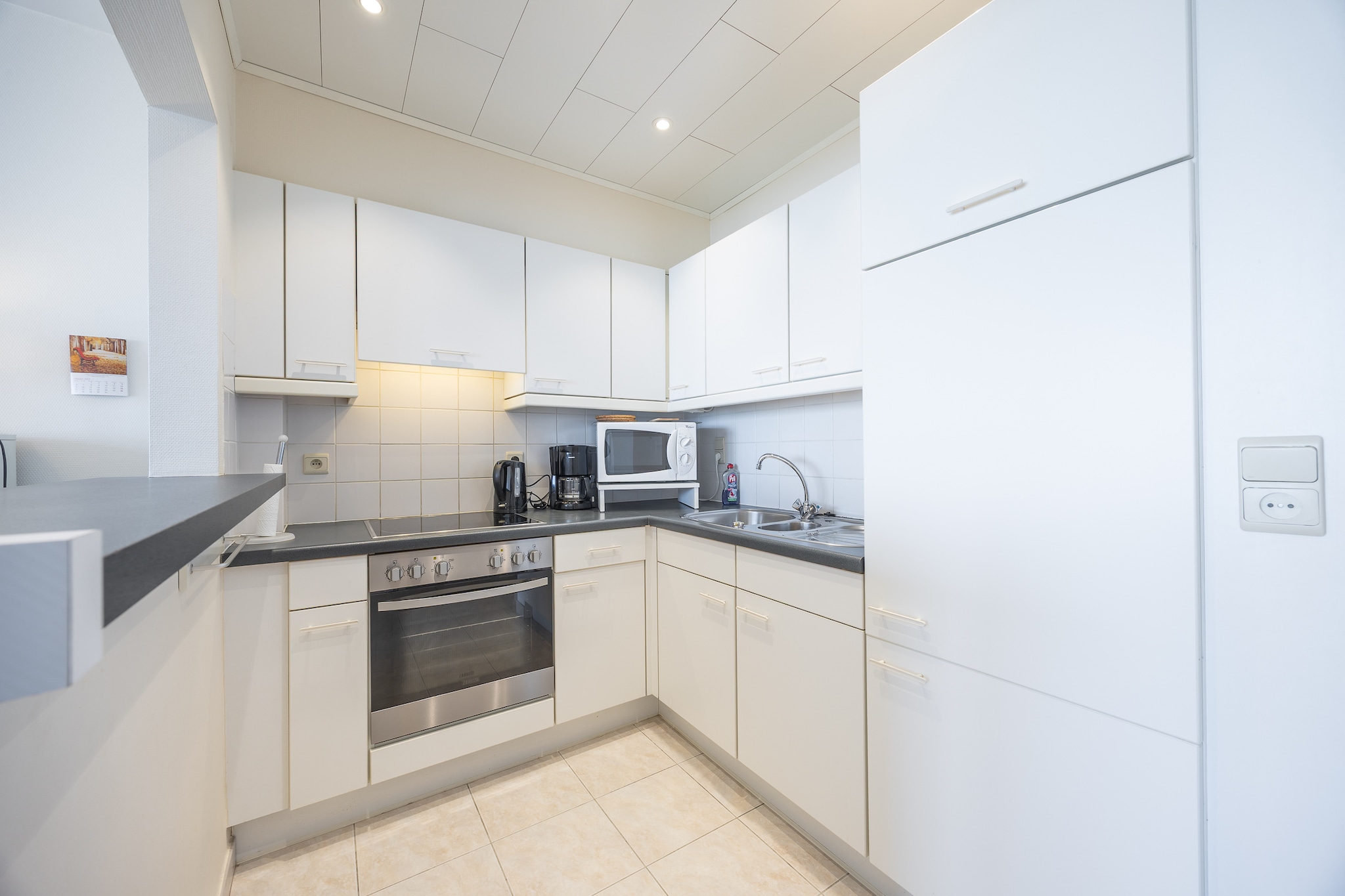 On the 4th floor: (open kitchen(toaster, coffee machine, oven, microwave, fridge, freezer, dishes and cutlery, Cooking basics), Living/diningroom(TV, dining table, seating area, radio), bedroom(double bed(twin blanket, 200 x 220 cm), double bed(twin duvet, 200 x 200 cm)), bathroom(shower, washbasin), toilet(toilet))\n\nheating(electric, gas), terrace, lift, drying cabinet