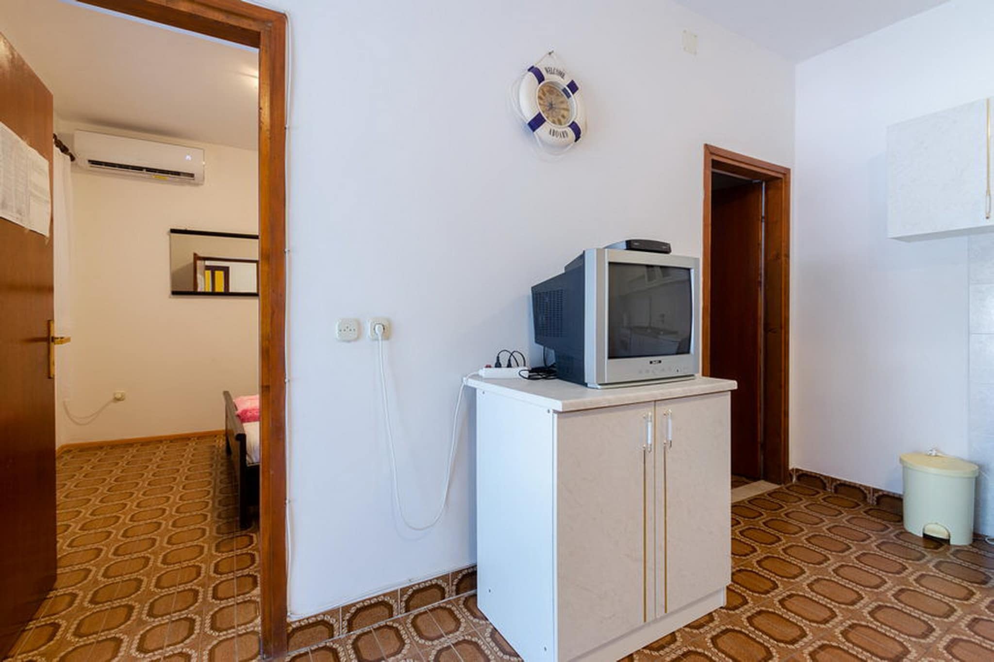 Apartments Katica's Place is located on island Korčula. 

A private terrace with an outdoor furniture is at your disposal, which makes this place this place ideal for a nice and relaxing family or friends vacation.

Private parking is provided, reservation is not needed. 

Free Wi-fi is available throughout the property. 

Pets are allowed with notice and with an additional coast of 7 euros per night.

Baby cot is available upon request.

This one bedroom apartment with terrace and sea view can accommodate up to four people. The open space living room comes with sofa and sitting area, and it's combined with the equipped kitchen and dining area. The private bathroom comes with shower and toilet. This apartment is located on the ground floor.

If you want to spend your vacation in a peaceful and quiet environment, far from the city crowds, Apartments Katica's Place is the perfect spot for you. Beach is only 100 m away! Restaurant can be found  only 100 m from the property, while market is 2 km away.

Airport is located 180 km away, while bus stop is 7 km away.