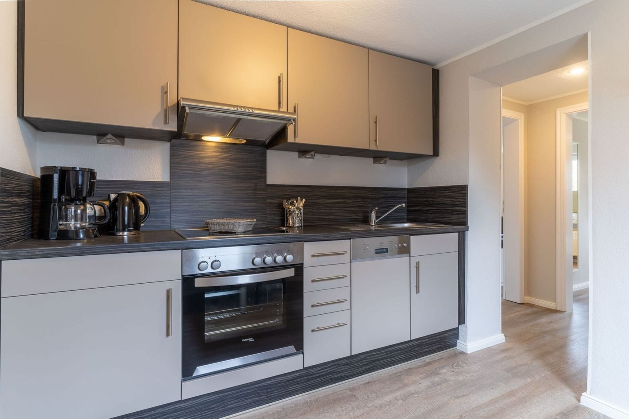 On the 1st floor: (Living room(TV, radio), Kitchen(dining table(2 persons), electric kettle, toaster, cooker(4 ring stoves, ceramic), hood, coffee machine, oven, dishwasher, fridge(+ freezer)), bedroom(double bed, TV), bathroom(shower, washbasin, toilet, hairdryer))\n\ntumble dryer(shared with other guests, paid), washing machine(shared with other guests, paid), balcony, heating, garden(shared with other guests), garden furniture, parking, ironing board, iron, Garden shed, Laundry Package incl.