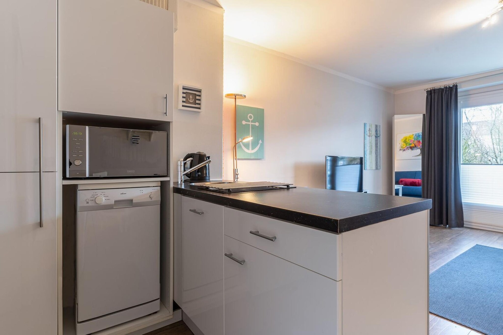 Ground floor: (open kitchen(hob(2 ring stoves, ceramic), electric kettle, toaster, coffee machine, combination microwave, dishwasher, fridge), Living/bed room(double sofa bed(180 x 200 cm), TV, dining table(2 persons), radio), bathroom(shower, washbasin, toilet))\n\nheating, terrace, garden furniture, parking, Laundry Package incl.