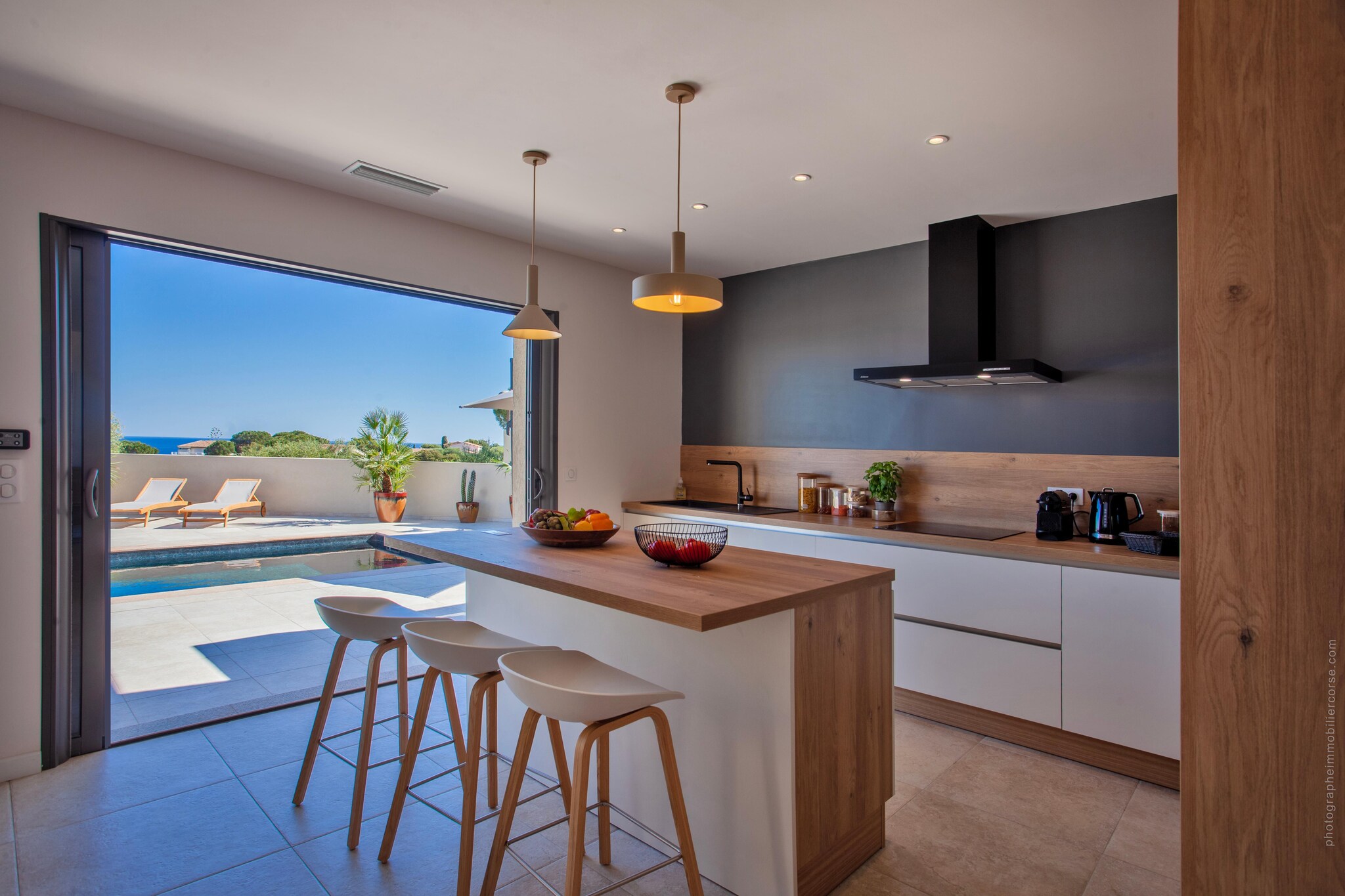 Ground floor: (open kitchen(coffee machine, dishwasher), Living/diningroom(TV, seating area), Bedroom with bathroom(double bed, bath tub, shower, toilet))\n\nOn the 1st floor: (bedroom(double bed), bedroom(double bed), bedroom(single bed, single bed), bathroom(shower, toilet), bathroom(shower, toilet))\n\nhot tub, air conditioning, terrace, BBQ, swimming pool(private)