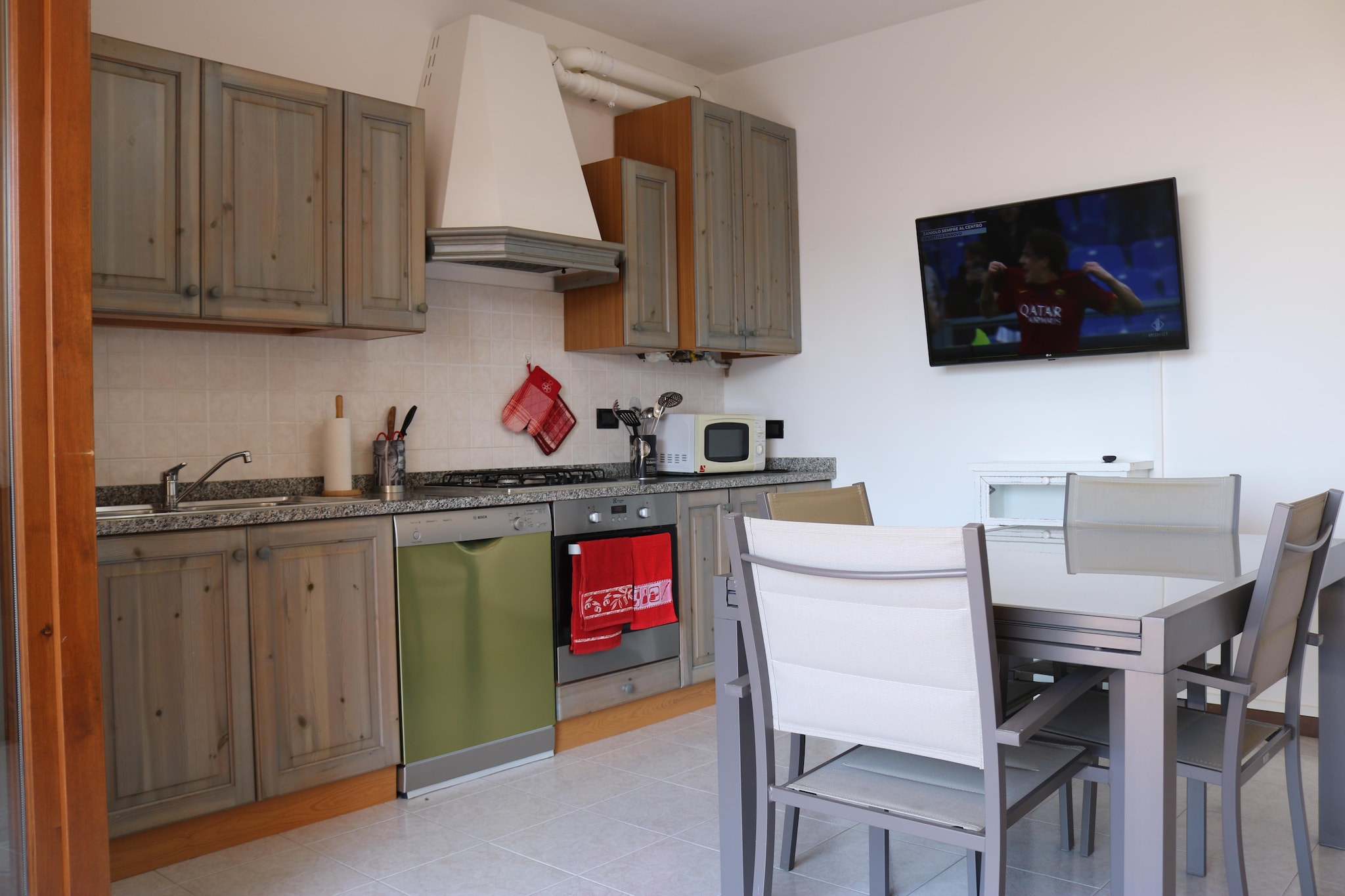 On the 1st floor: (open kitchen(hob(4 ring stoves, gas), oven, microwave, dishwasher, fridge-freezer), Living/diningroom(TV(satellite)), bedroom(double bed), bedroom(single bed, single bed), bathroom(shower, washbasin, toilet, bidet, washing machine), balcony, balcony, air conditioning, garden furniture)\n\nterrace(shared with other guests), swimming pool(shared with other guests, opened from Jun upto and including Sep)