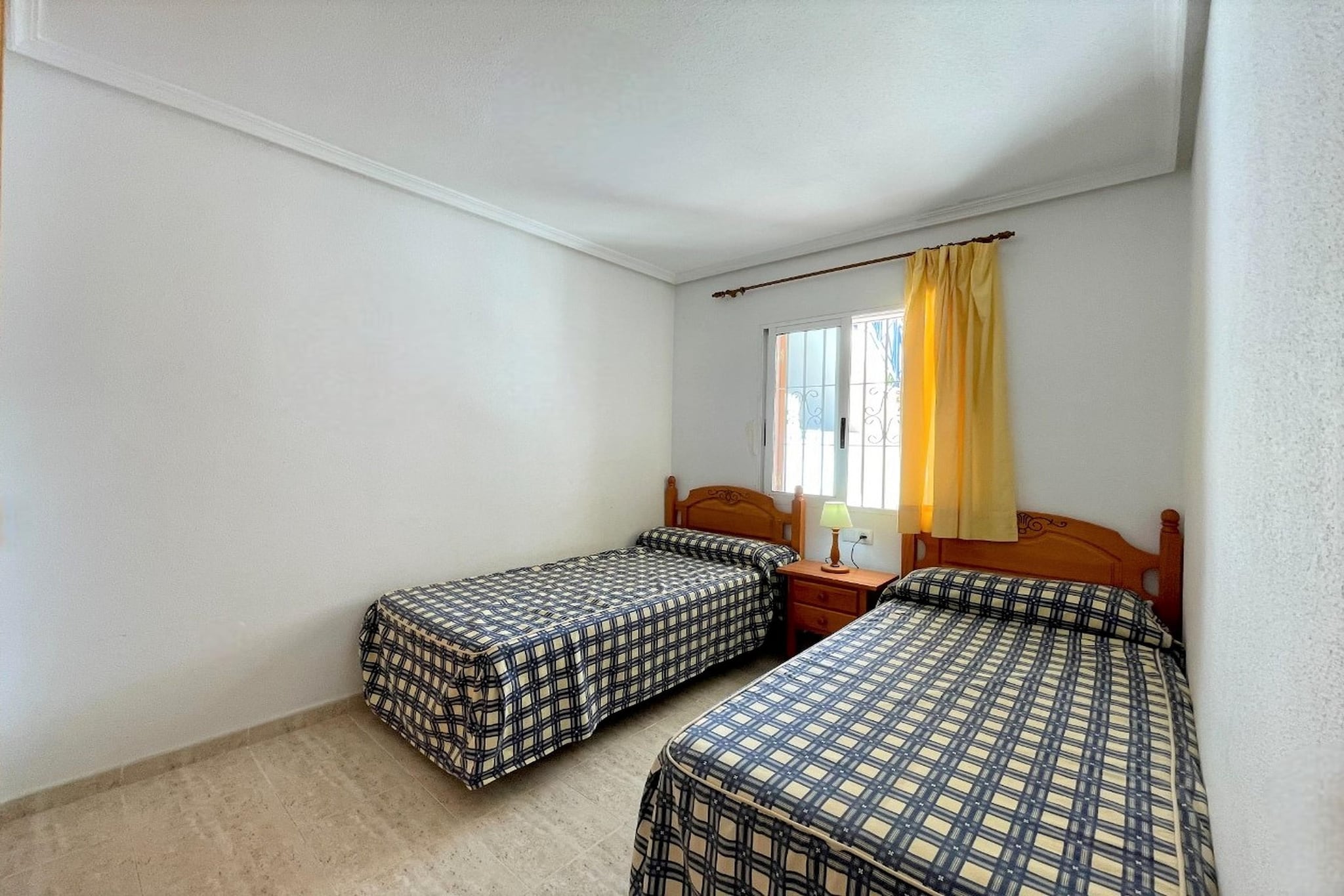 Ground floor: (Entrance(reachable from the outside), open kitchen(hob, toaster, hood, coffee machine, oven, microwave, dishwasher, fridge-freezer), Living/diningroom(double sofa bed, TV(flatscreen), dining table, seating area), bedroom(double bed(135 x 190 cm)), bedroom(single bed(90 x 190 cm), single bed(90 x 190 cm)), bathroom(bathtub with shower, washbasin, toilet), washing room(washing machine, ironing board, iron), air conditioning, terrace(private), garden furniture, air to air heatpump)\n\ngarden(shared with other guests, illuminated), parking lot(public), swimming pool(shared with other guests, outside, opened from Apr upto and including 1/2 Sep)